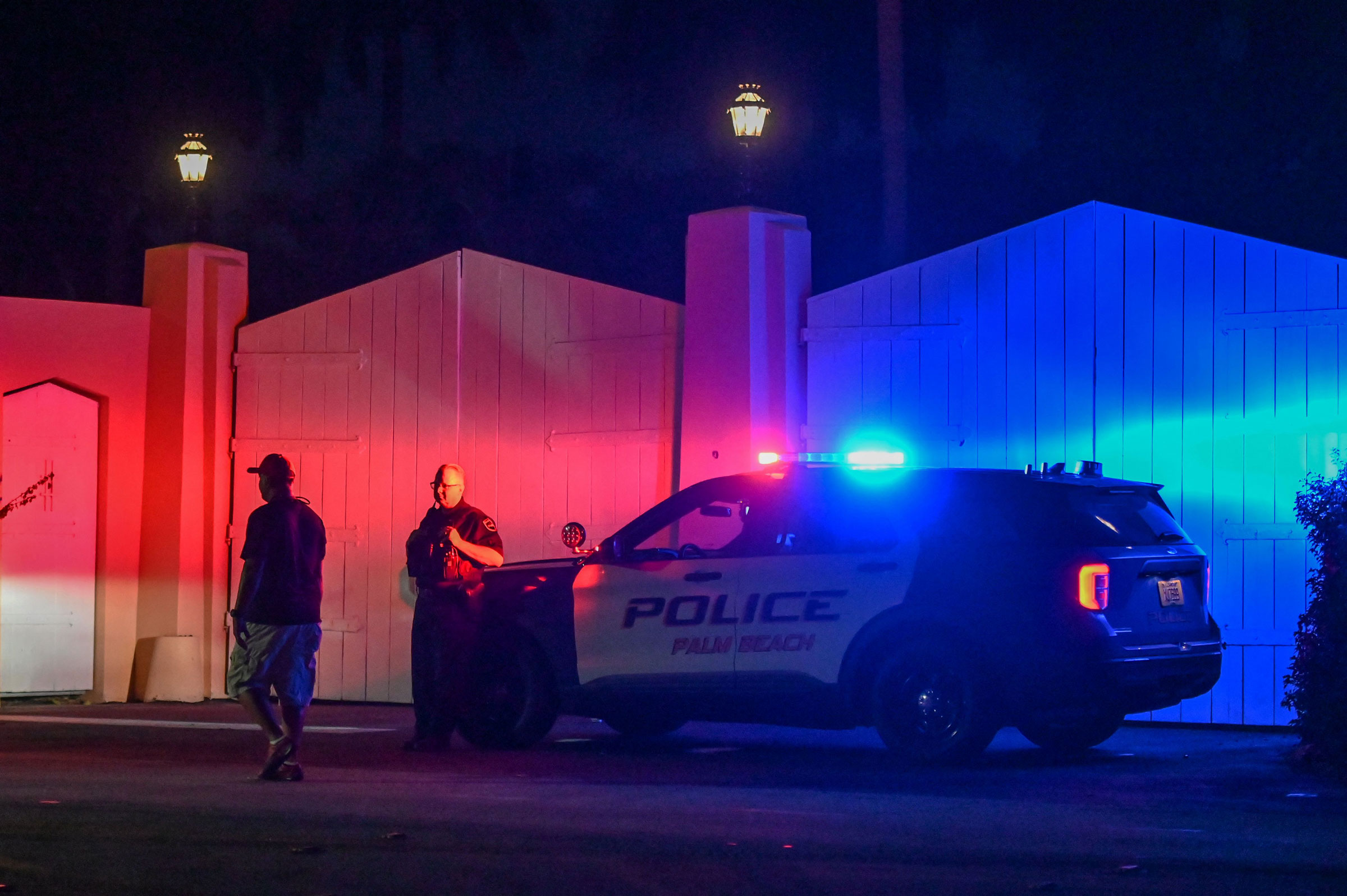 A police car is seen outside former US President Donald Trump's residence in Mar-A-Lago