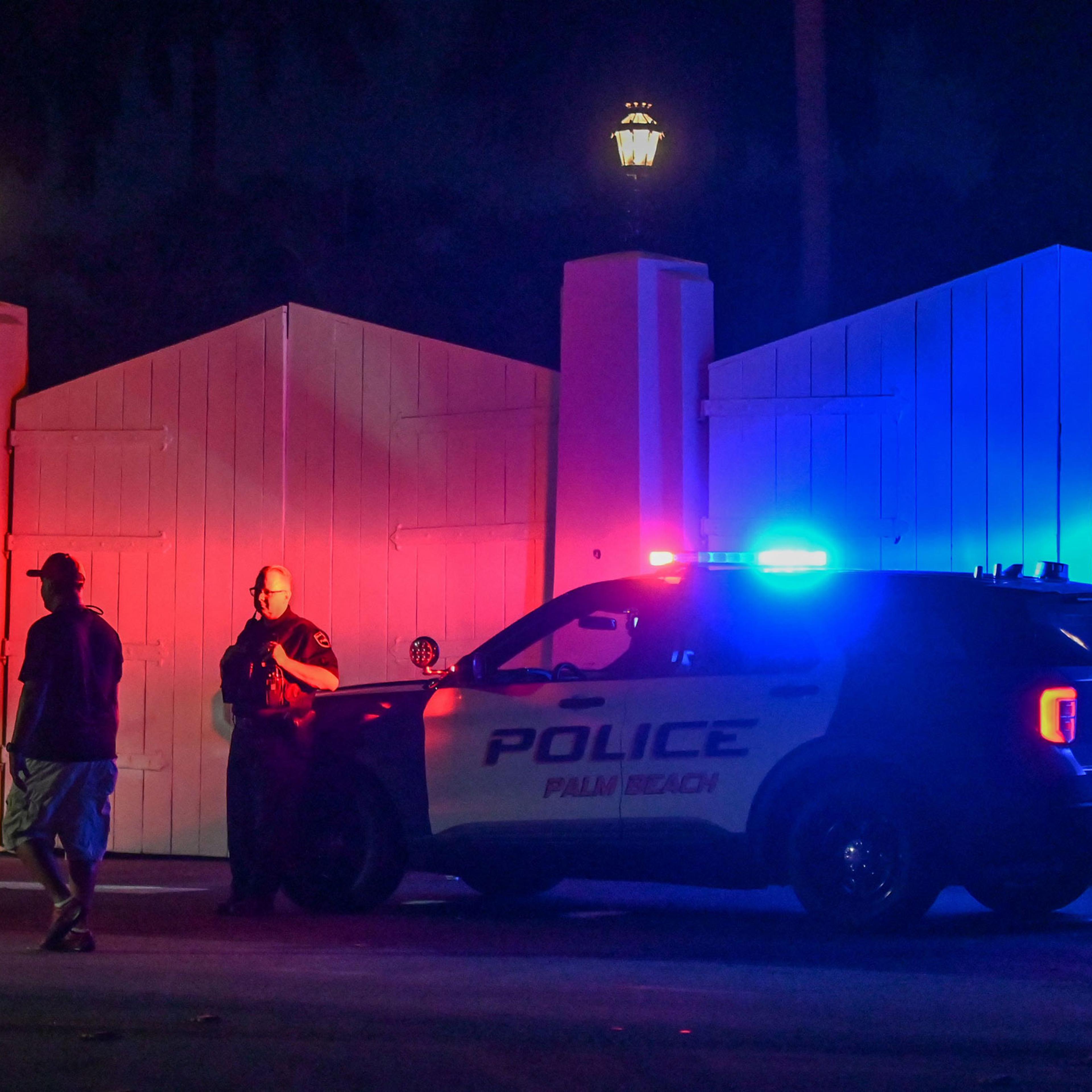 A police car is seen outside former US President Donald Trump's residence in Mar-A-Lago