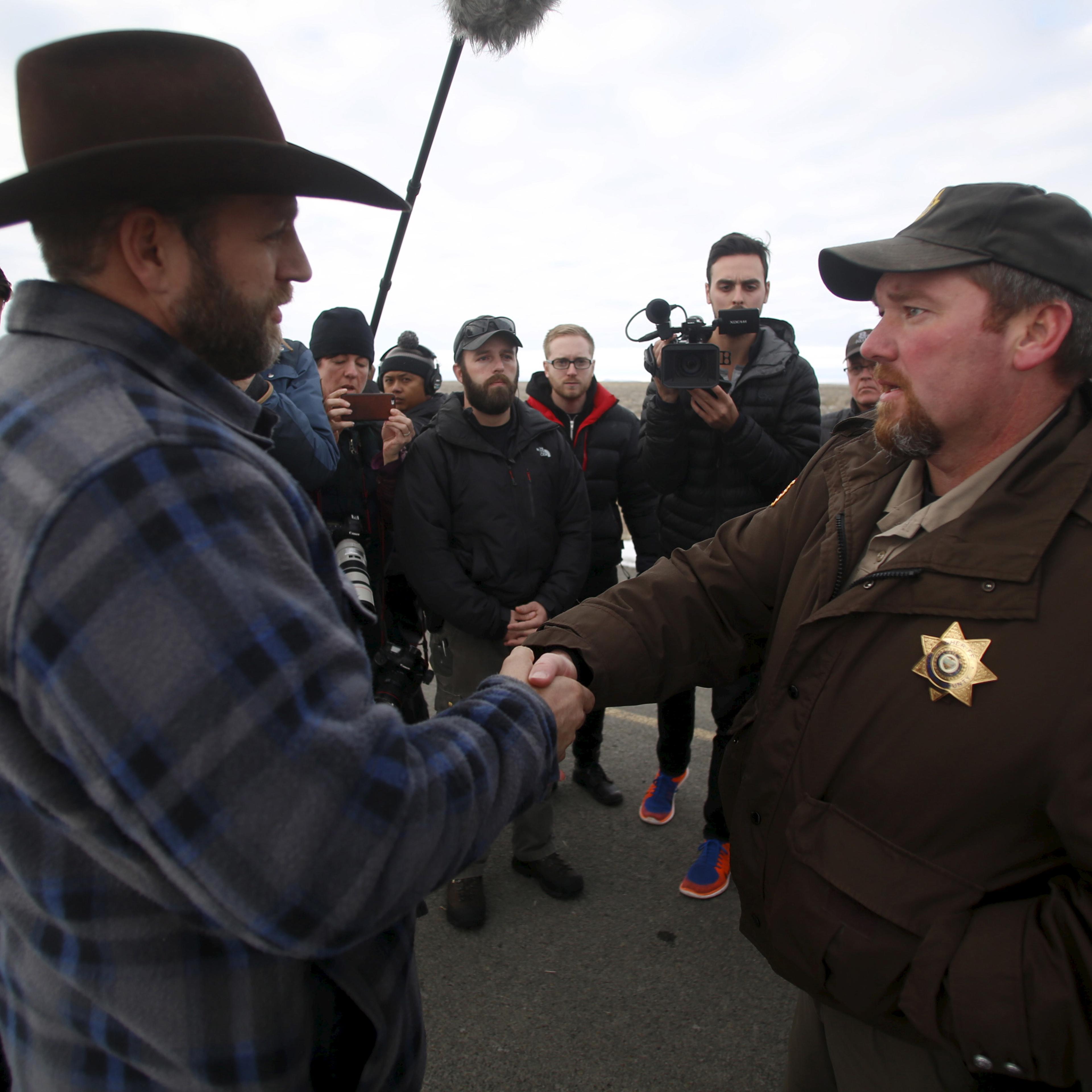 Ammon Bundy meets with Harney County Sheriff David Ward along a road south of the Malheur National Wildlife Refuge near Burns, Oregon
