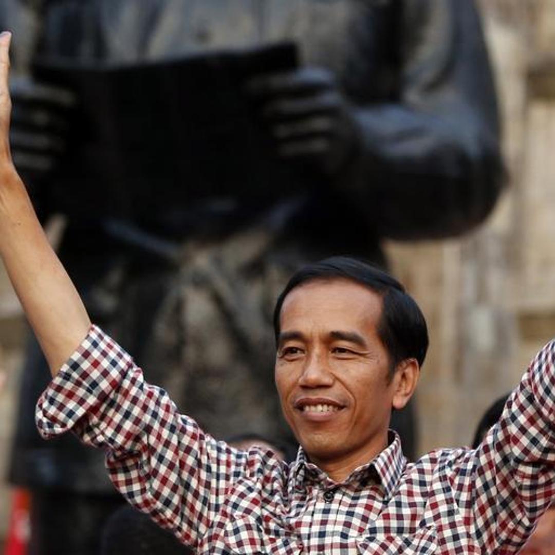 Indonesian presidential candidate Joko "Jokowi" Widodo gestures during a rally in Proklamasi Monument Park in Jakarta