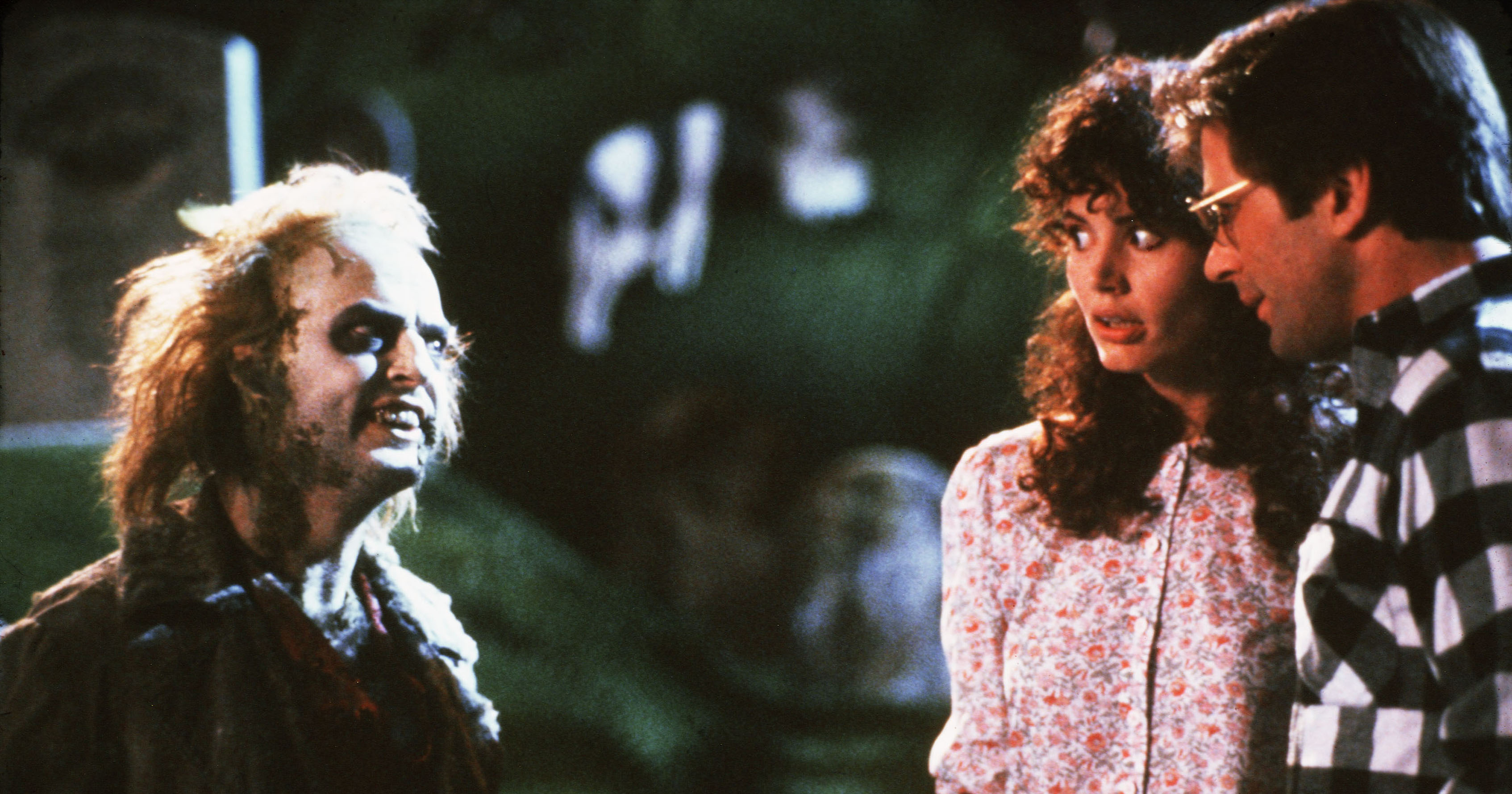 From left: Michael Keaton, Geena Davis, and Alex Baldwin in Beetlejuice.