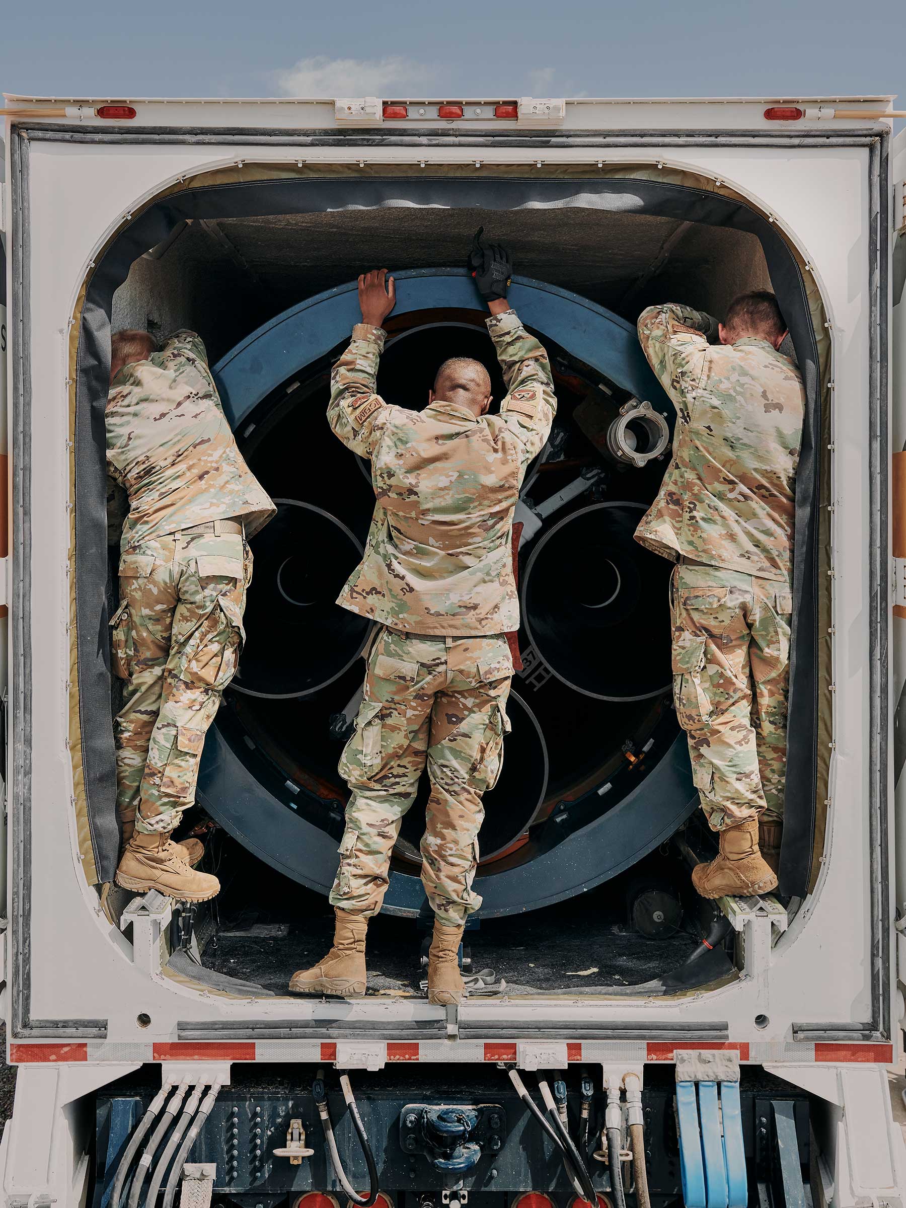 Preparing a Minuteman III to be lowered into the silo. 