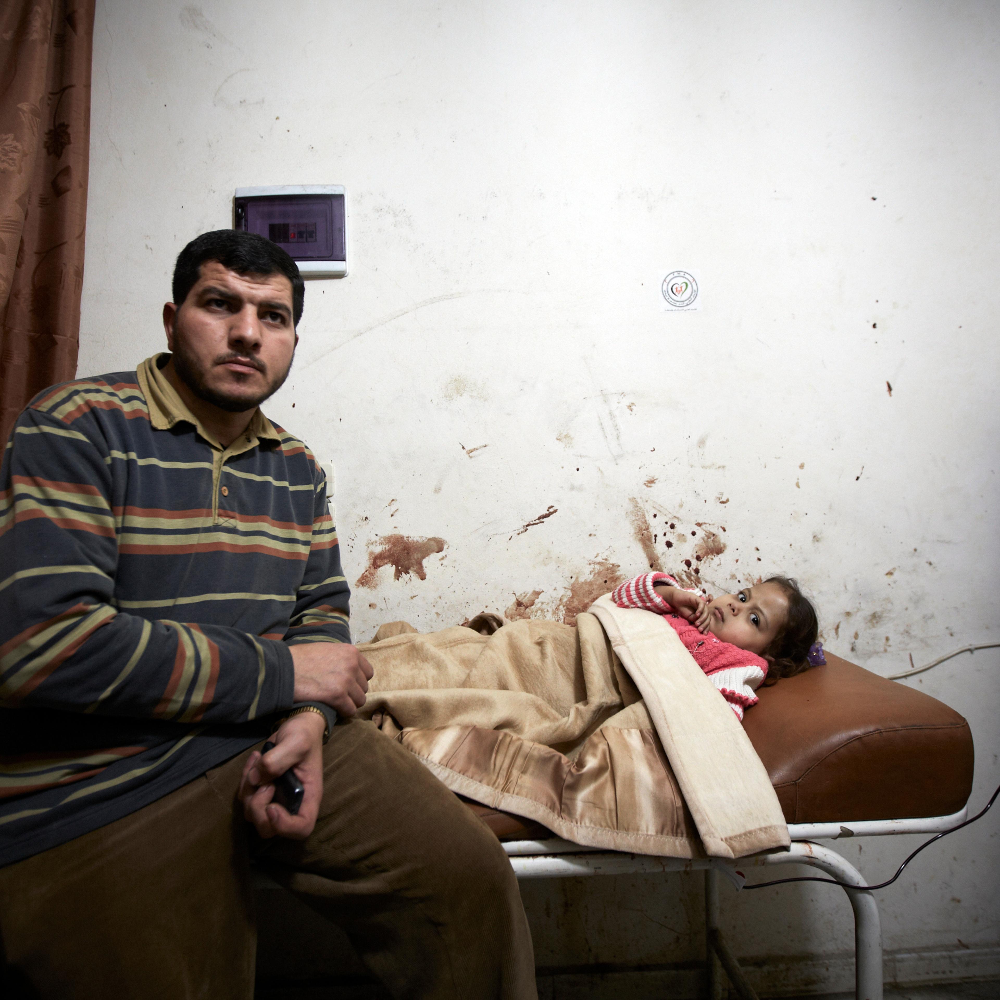 A wounded child is treated in a make shift hospital in Aleppo after her home was randomly targeted by the regime's artillery, on March 15, 2013.