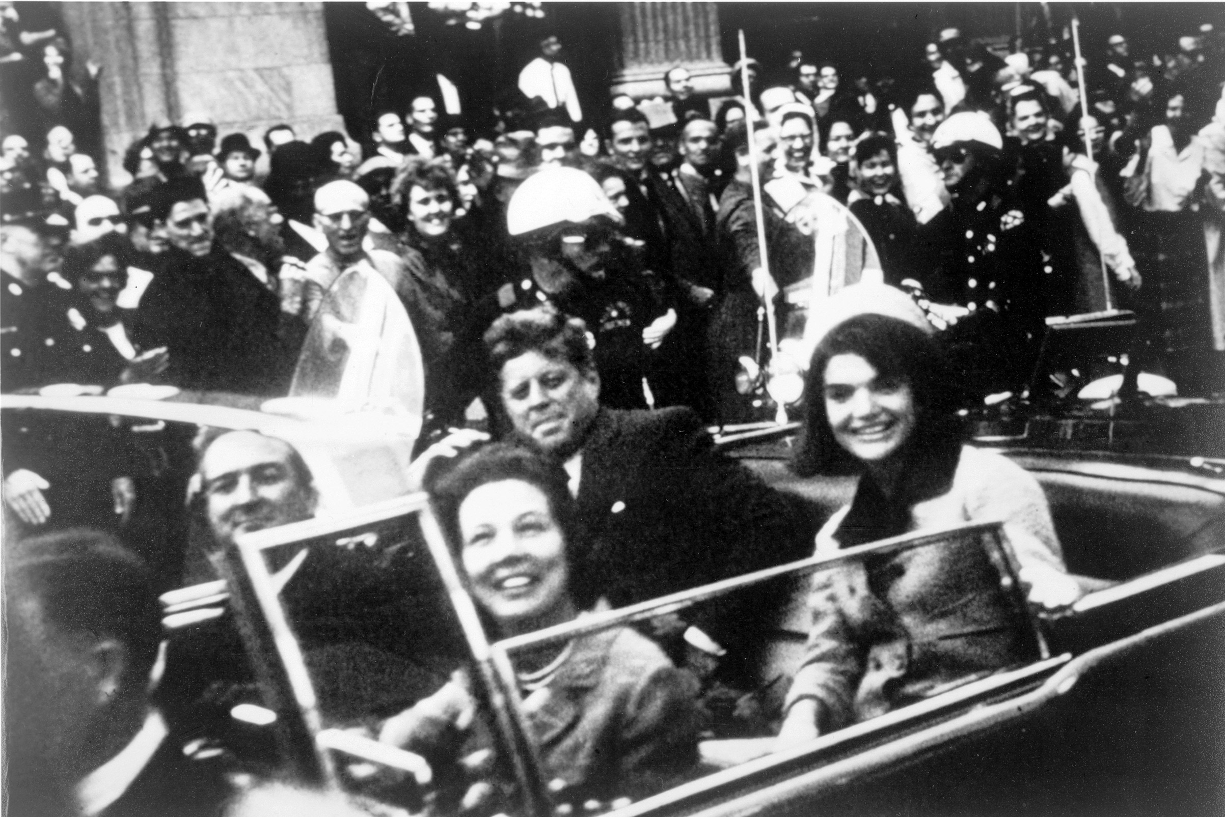 President John F. Kennedy and First Lady Jackie Onasis Kennedy in motorcade with  Texas Governor John Connally and his wife in motorcade on Nov. 22, 1963, in Dallas.