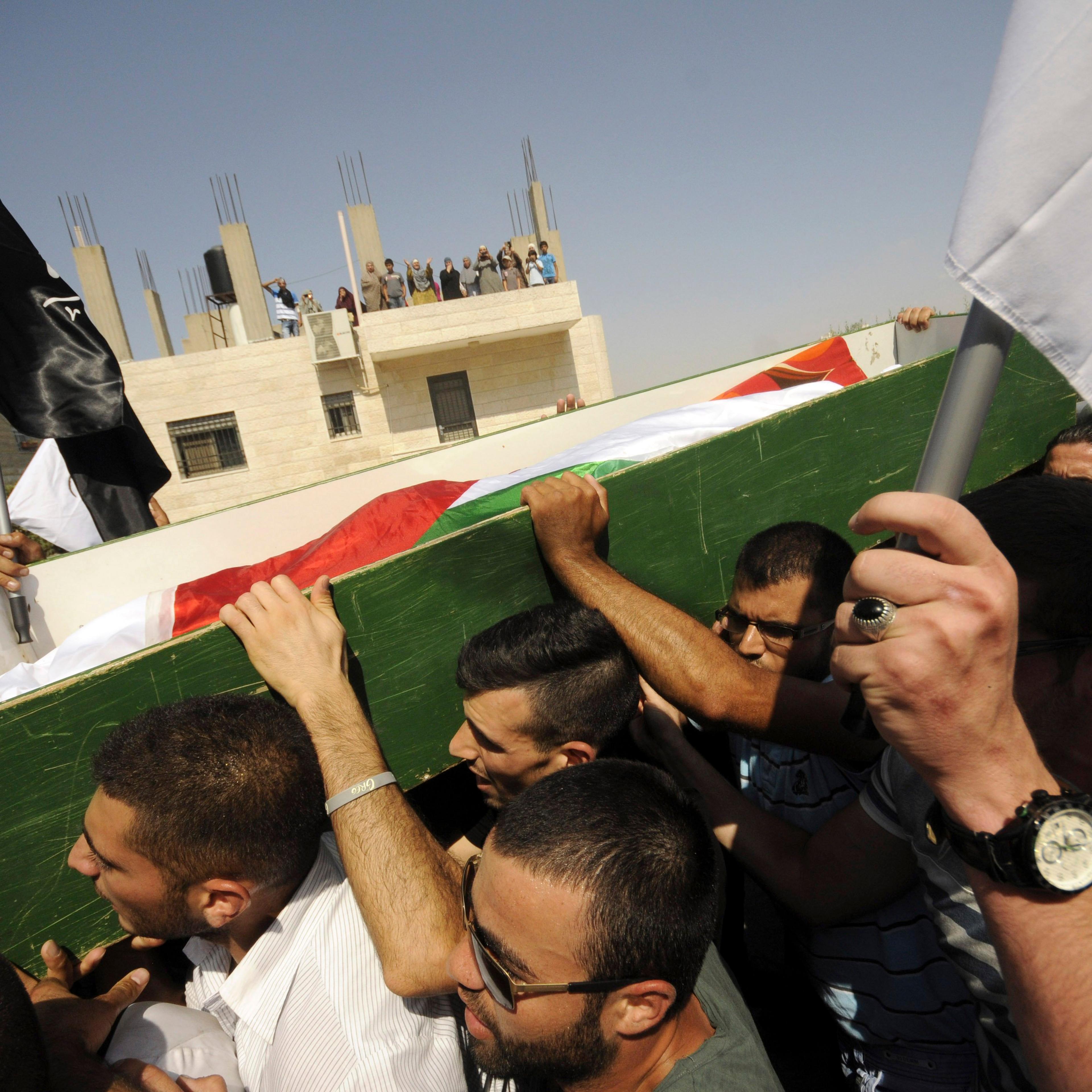 Palestinians carry the body of 16-year-old Mohammed Abu Khdeir in Jerusalem on Friday, July 4, 2014.