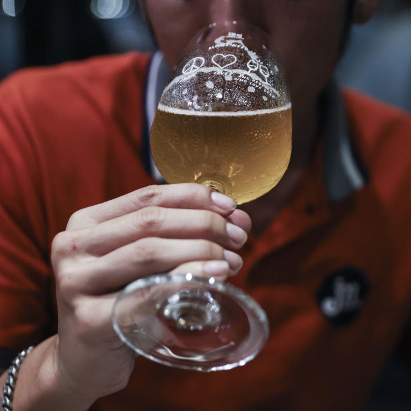 A customer drinks beer inside the United Peoples Brewery in Bangkok, Thailand, on Wednesday, July 26, 2023.