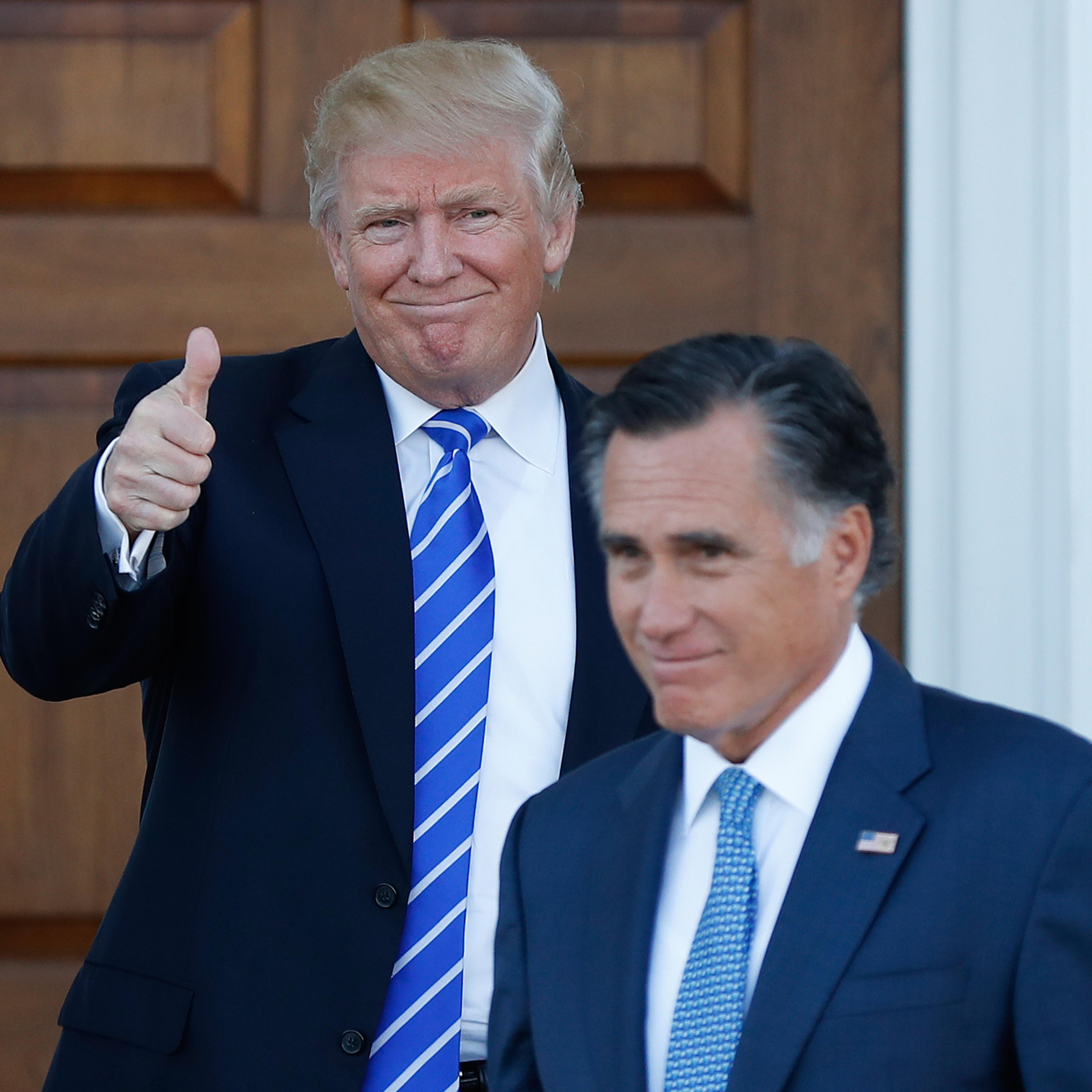 President-elect Donald Trump gives the thumbs-up as Mitt Romney leaves Trump National Golf Club Bedminster in Bedminster, N.J., Saturday, Nov. 19, 2016. (AP Photo/Carolyn Kaster)