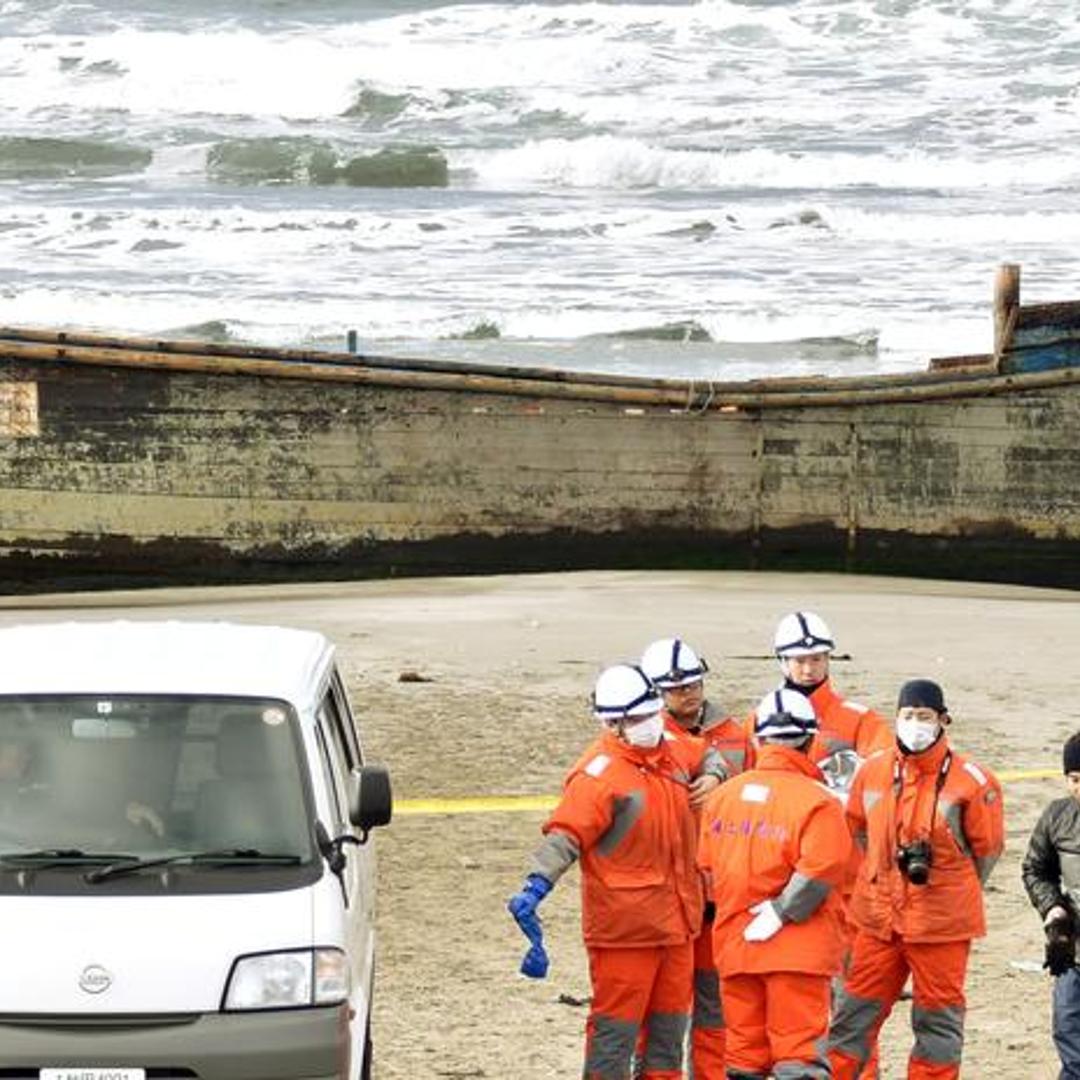 A wooden boat, which drifted ashore with eight partially skeletal bodies and was found by the Japan Coast Guard, is seen in Oga, Akita Prefecture, Japan