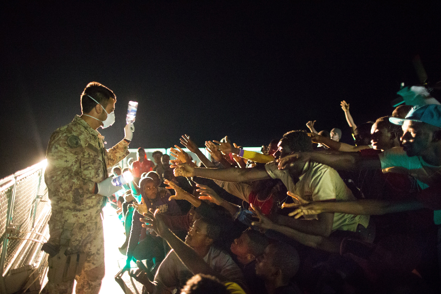 African asylum seekers rescued off boats and taken aboard an Italy navy ship, June 8.
