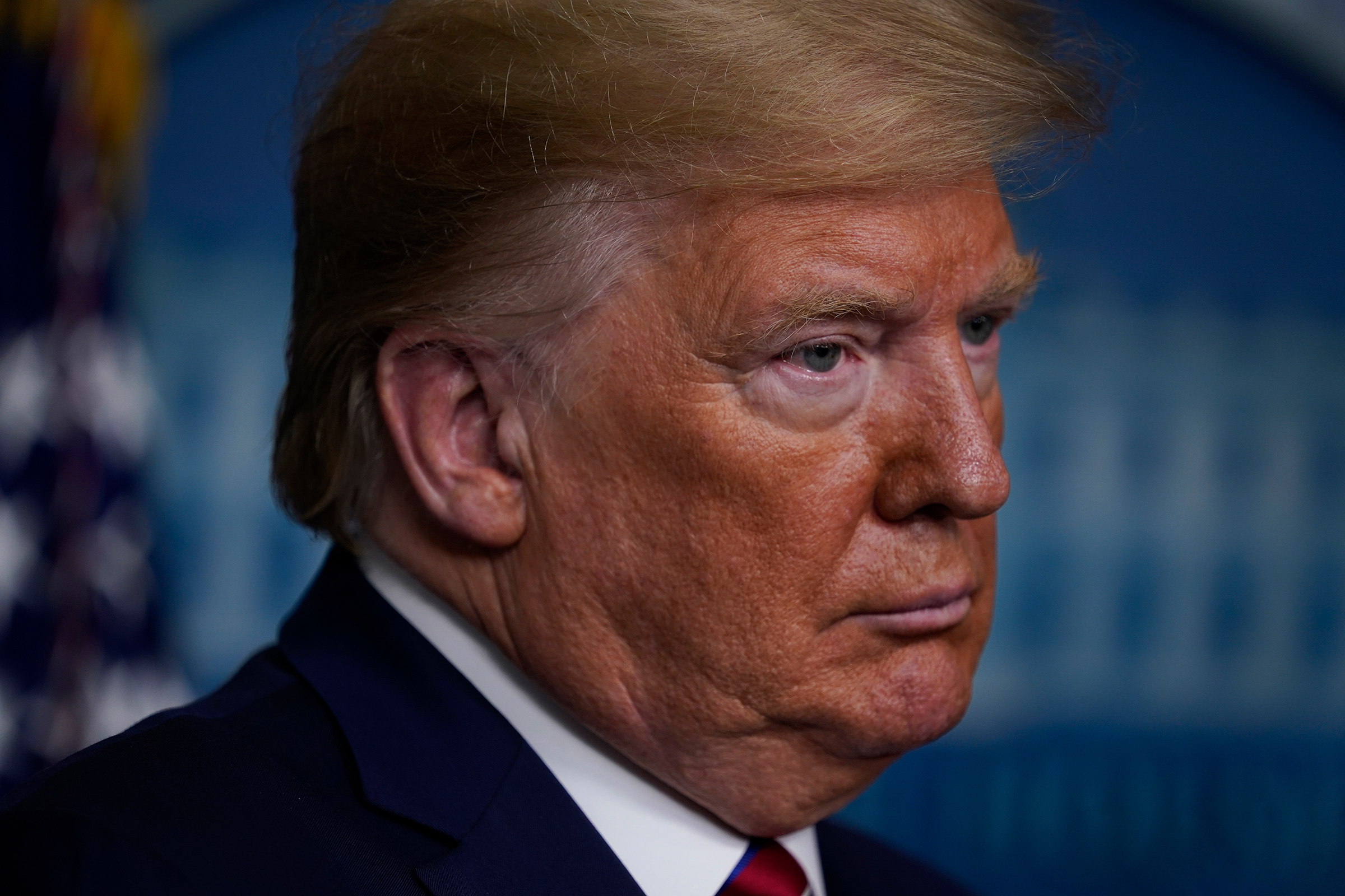 President Donald Trump listens during a coronavirus task force briefing at the White House, Friday, March 20