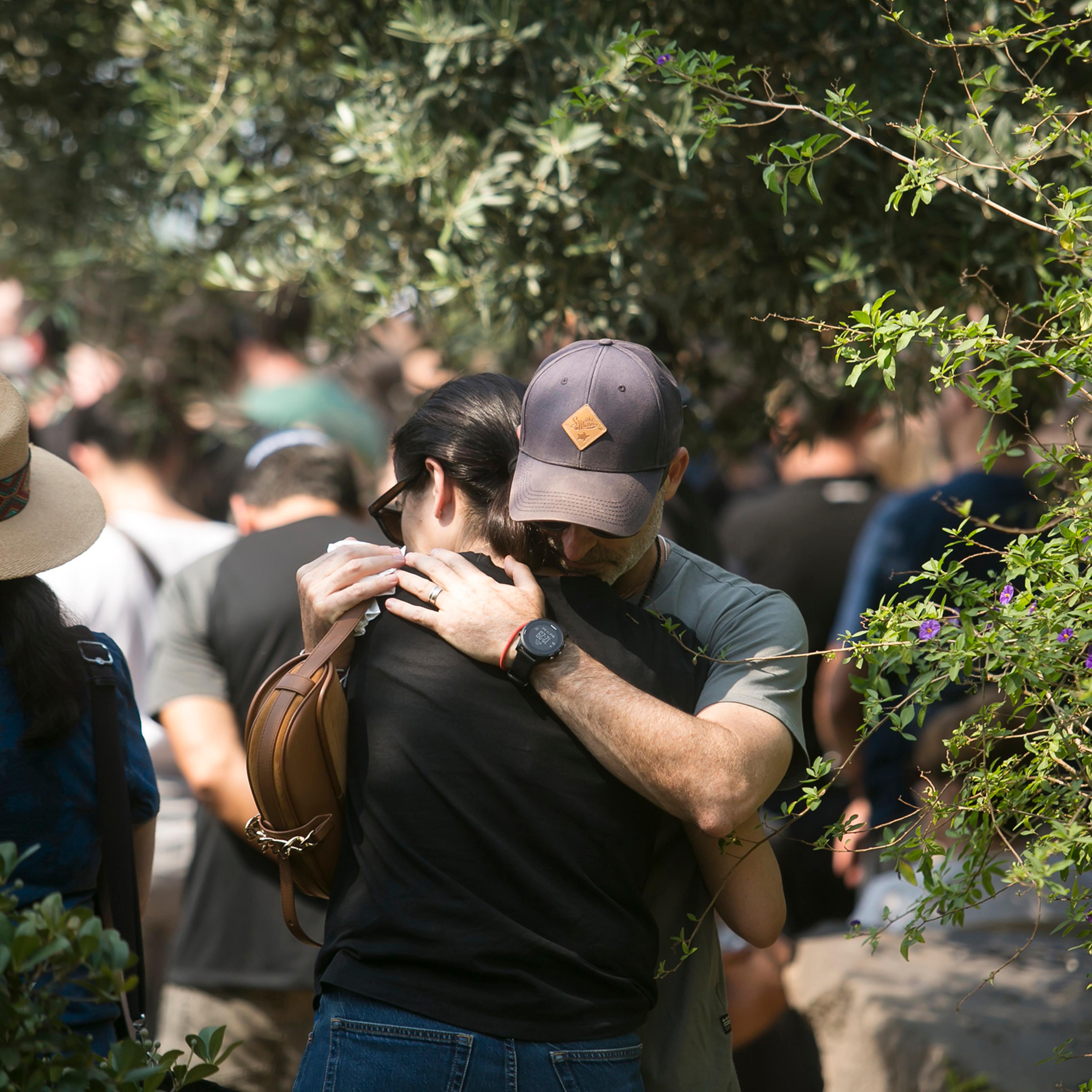 Family and friends of May Naim, 24, who was killed by Hamas, react during her funeral in Gan Haim, Israel, on Oct. 11, 2023.