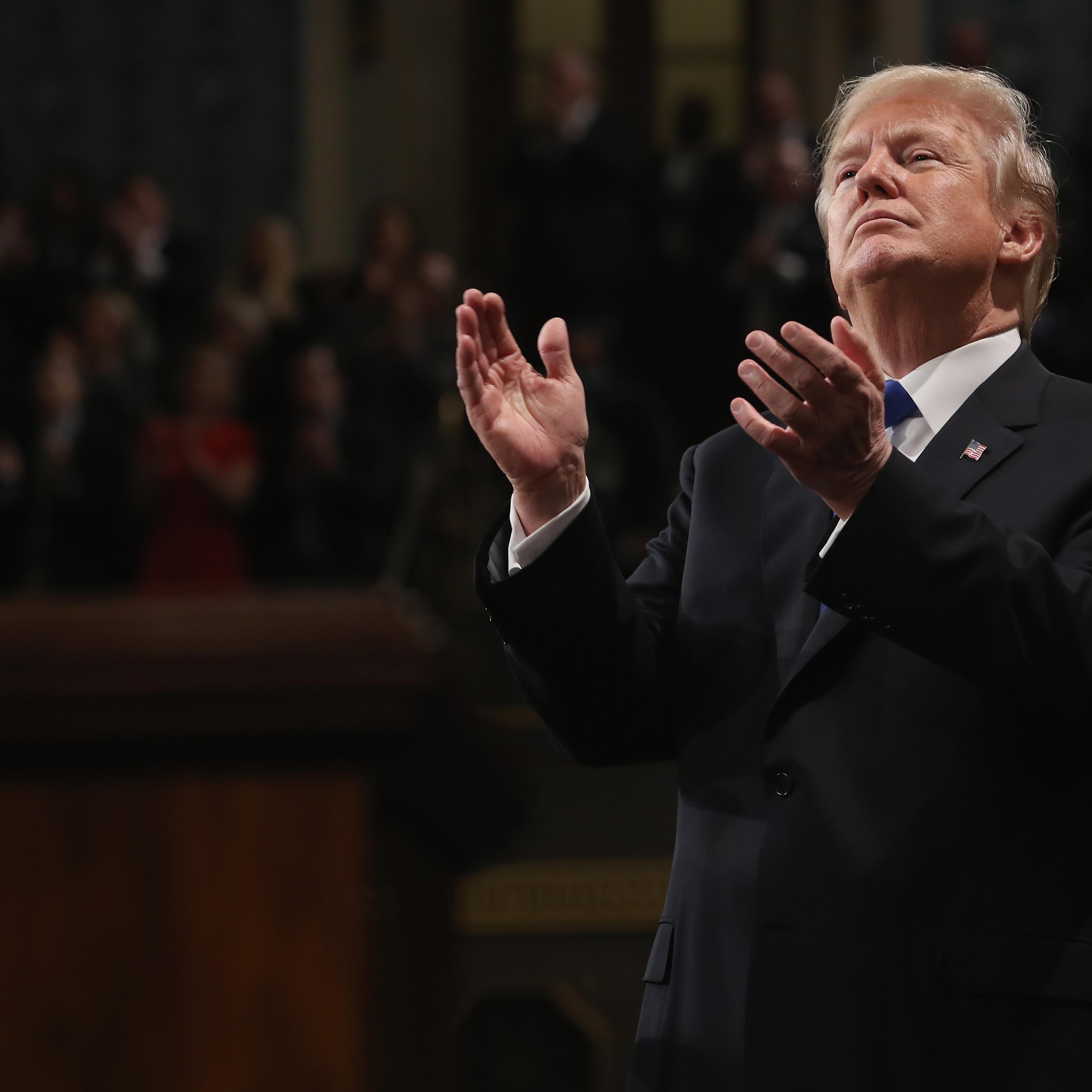 U.S. President Donald J. Trump claps during the State of the Union address in the chamber of the U.S. House of Representatives January 30, 2018 in Washington, DC.