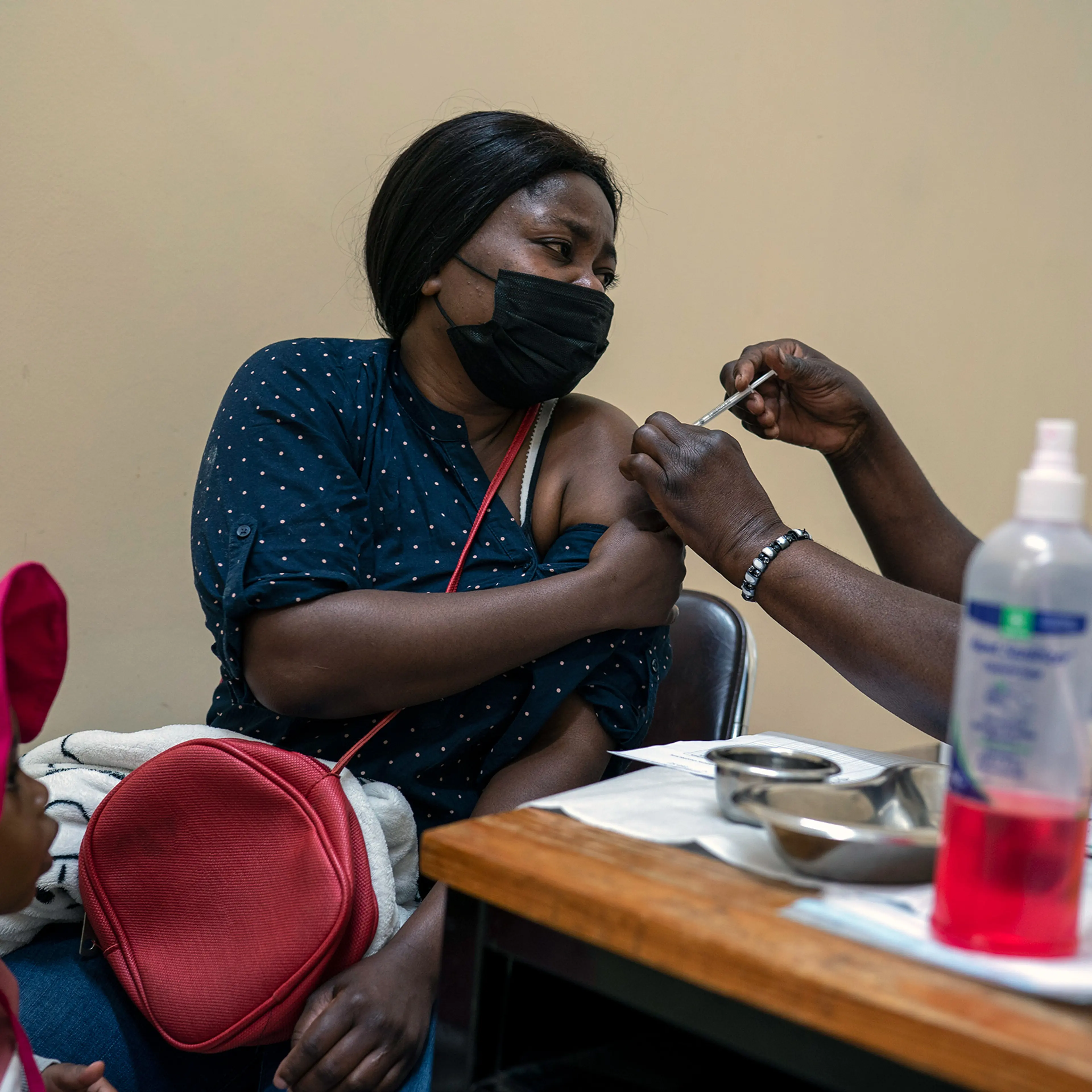 A woman receives a dose of COVID-19 vaccine in Johannesburg, South Africa, on Tuesday, Nov. 30, 2021. Vaccines are finally available in many African countries, but some people there are wary of taking them