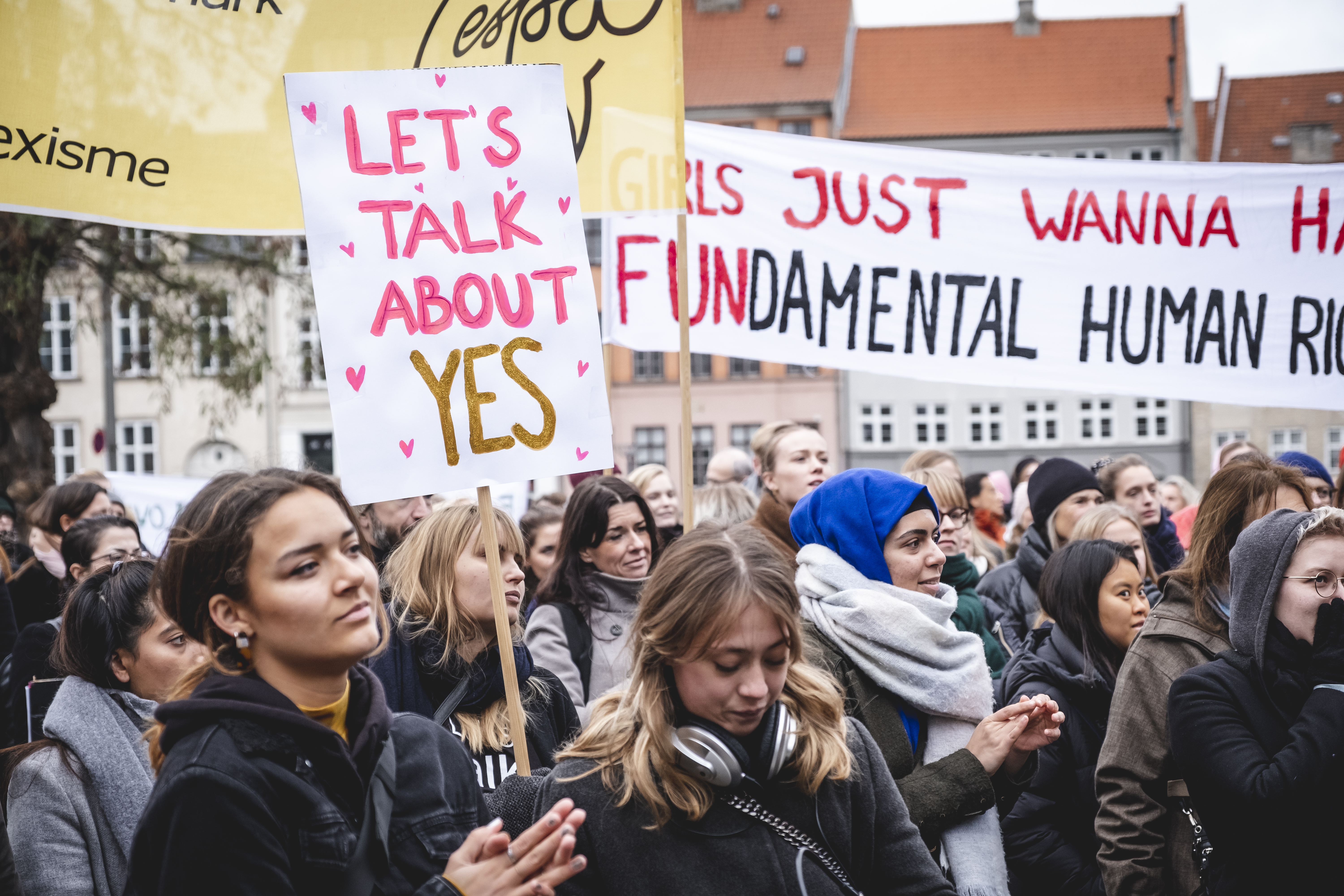 Women attend a "Let's Talk About Yes' protest in Denmark. 