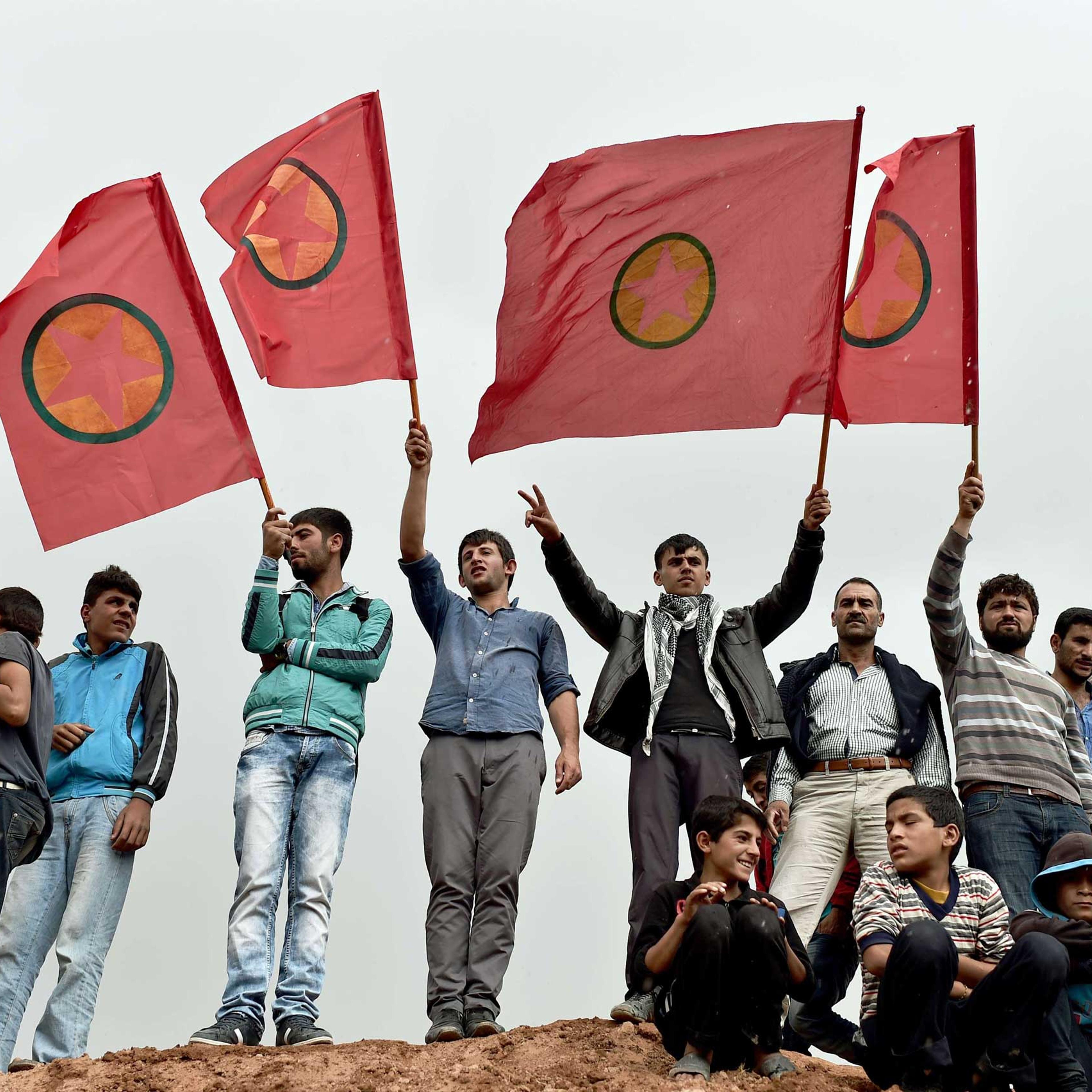 Kurdish people wave Kurdistan Workers' Party (PKK) flags while attending a funeral ceremony for YPG (People's Protection Units) fighters in the town of Suruc, Sanliurfa province, on Oct. 14, 2014.