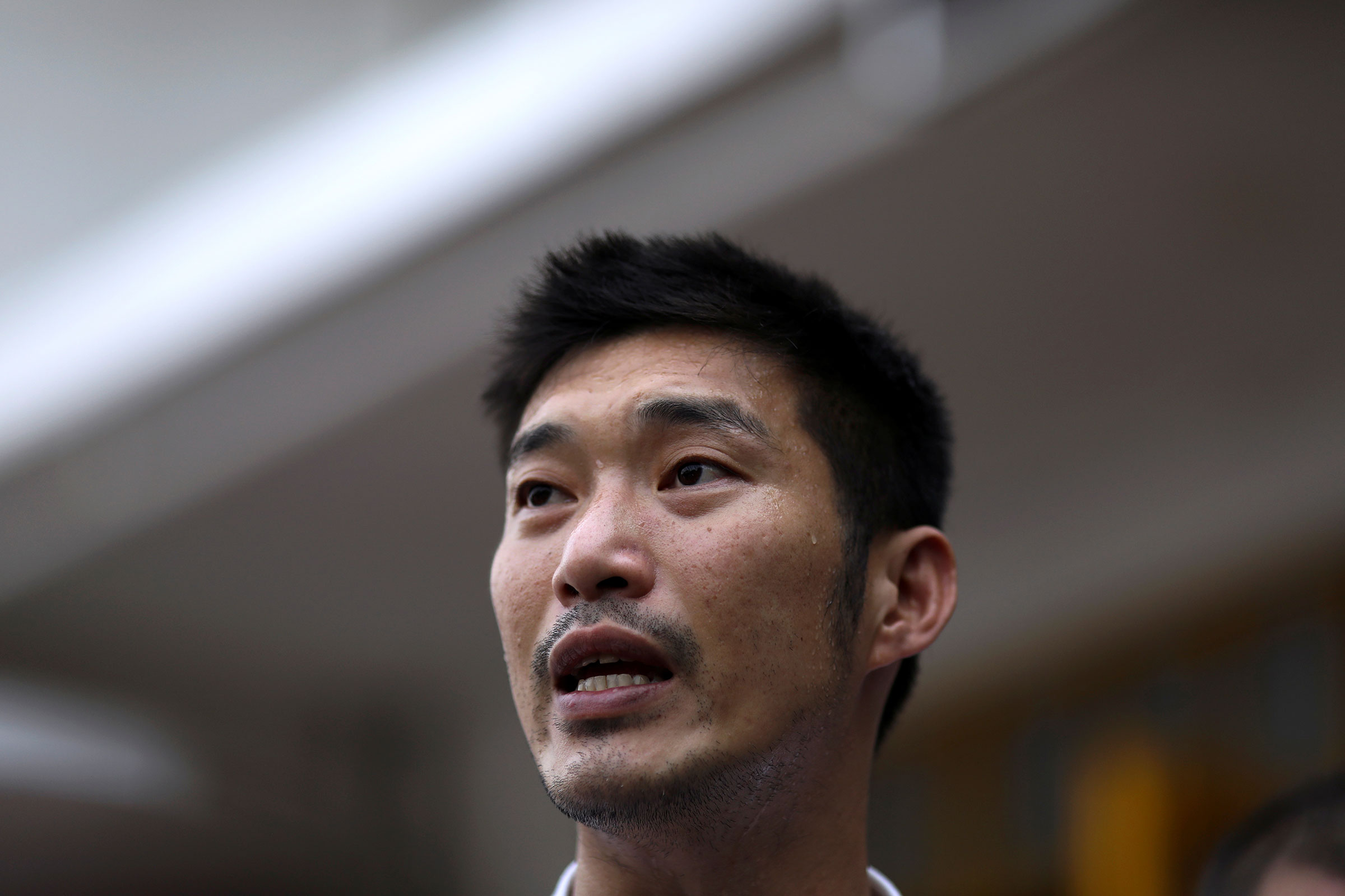 Thailand's opposition Future Forward Party leader Thanathorn Juangroongruangkit speaks before he reports to a Bangkok police station to hear charges filed against him for organizing the country's biggest protest since the 2014 coup in Thailand