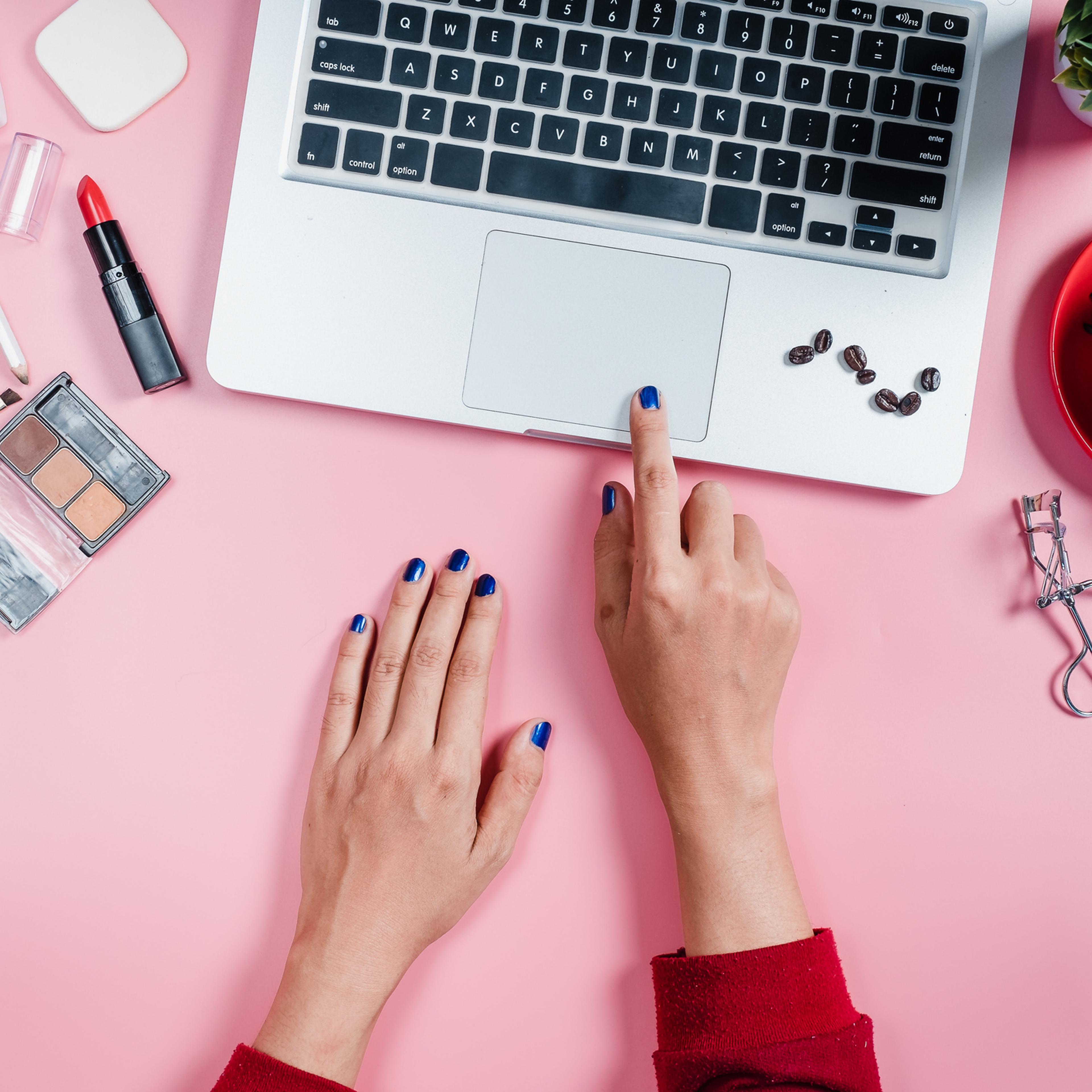 Cropped Image Of Woman With Laptop At Table