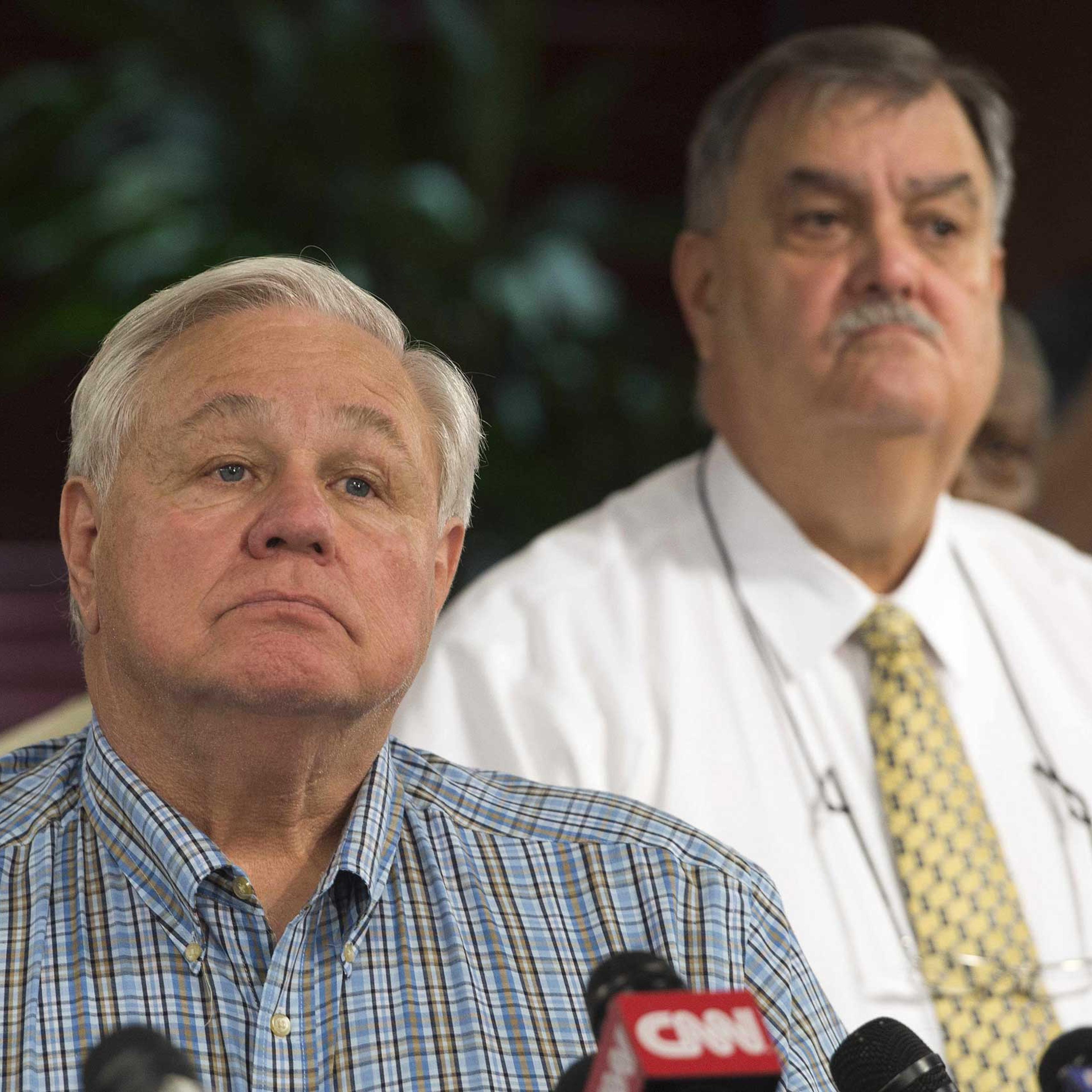North Charleston Mayor R. Keith Summey (L) and Police Chief Eddie Driggers take questions during a press conference at City Hall in Charleston, S.C. on April 8, 2015.