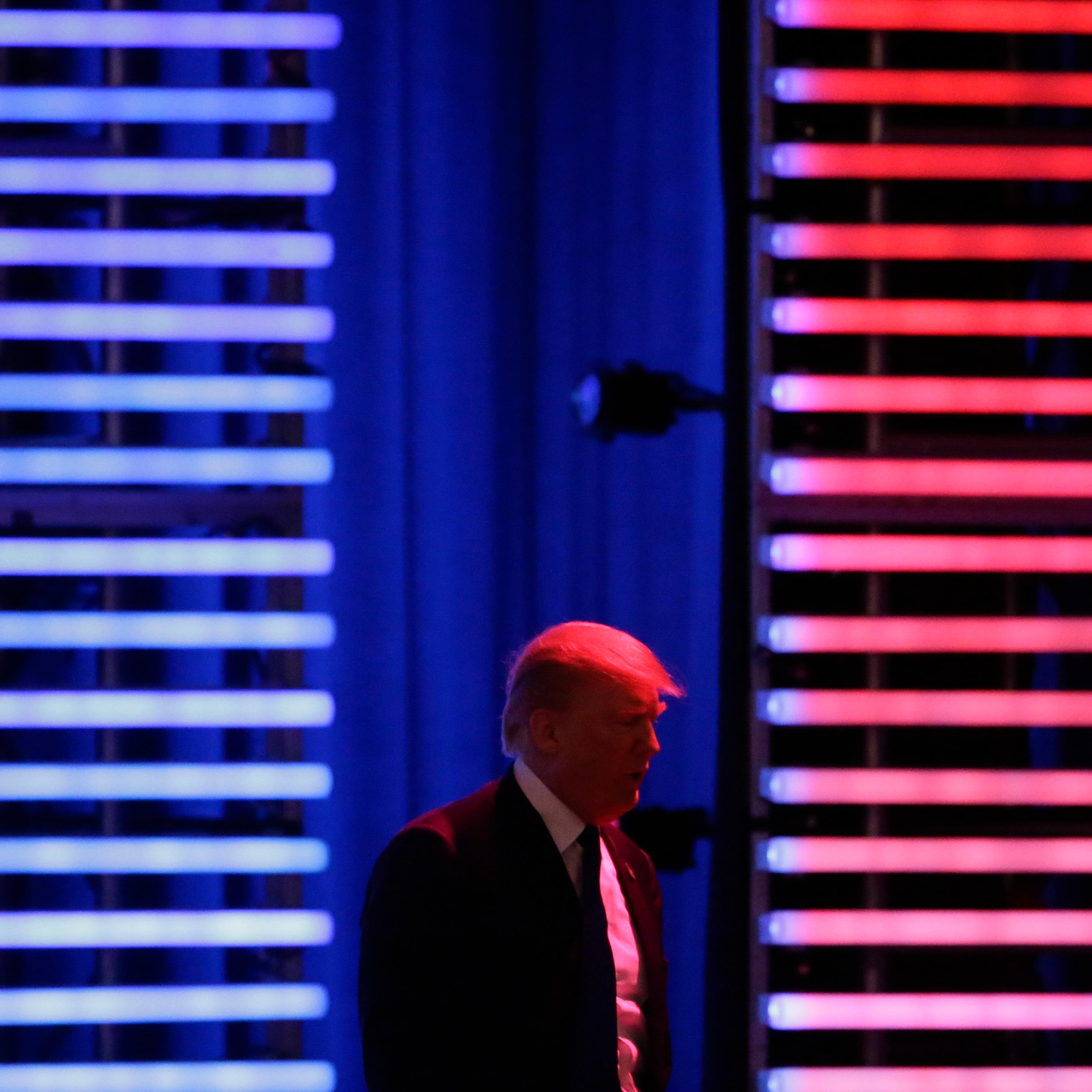 Republican presidential candidate, businessman Donald Trump walks on stage during a Republican presidential primary debate hosted by ABC News at the St. Anselm College on Saturday, Feb. 6, 2016, in Manchester, N.H.