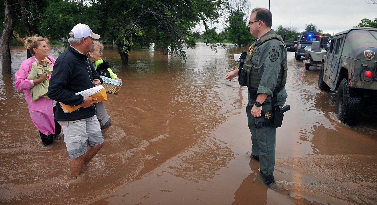 Wichita County Sheriff's deputies assisted an elderly woman after she and her pets were rescued from her home west of Wichita Falls, Texas