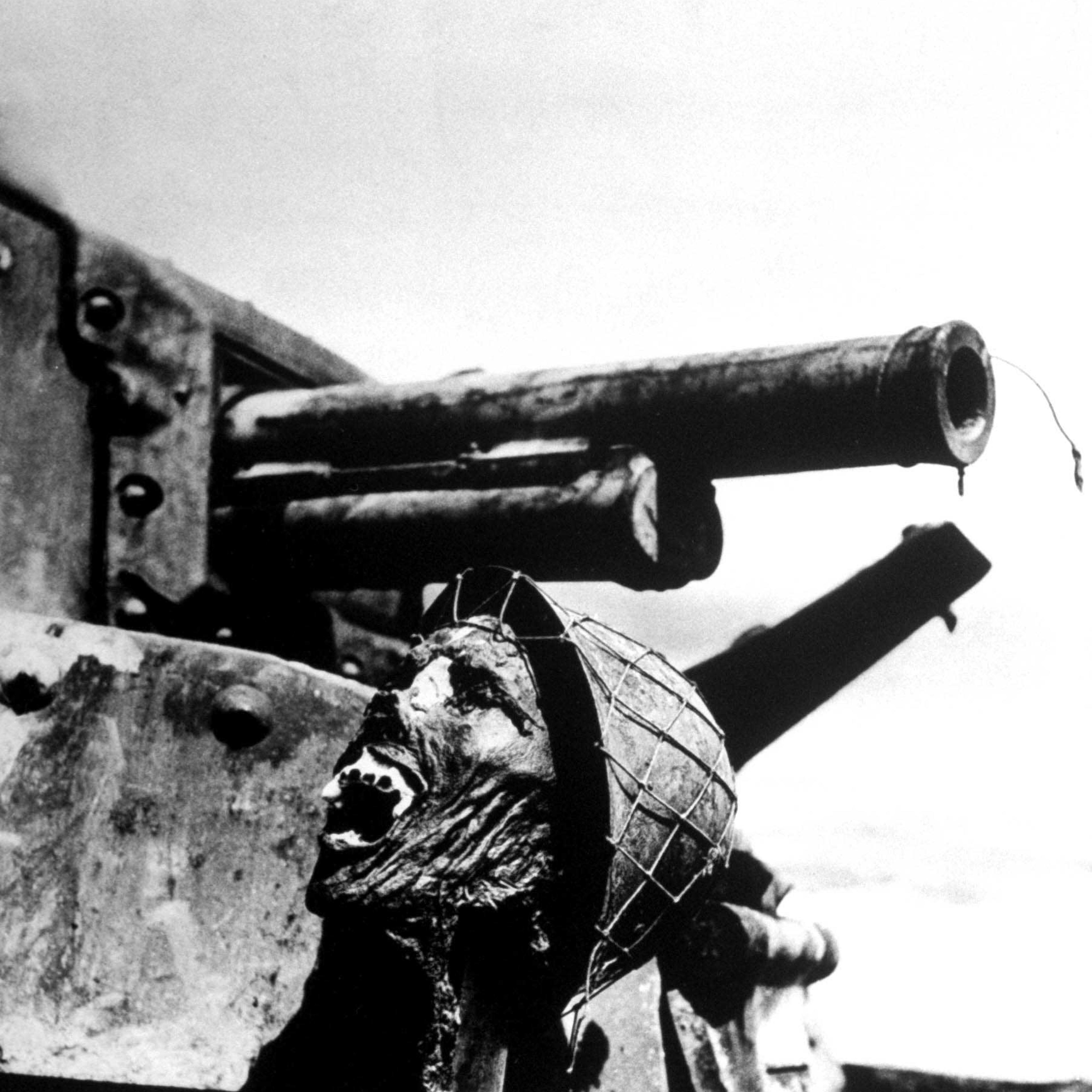 Severed head of a Japanese soldier, propped up on a disabled tank, Guadalcanal, 1942.