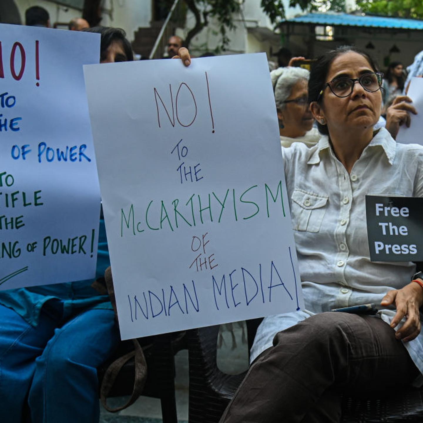 India Members of the media hold placards in a protest against the raids of homes of journalists and writers belonging a news portal in New Delhi, India on Oct. 04, 2023. Police Raids