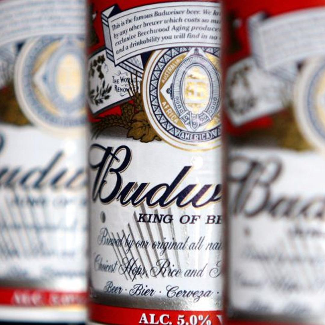 Bottles of Budweiser beer sit on display at a pub in Hornchu