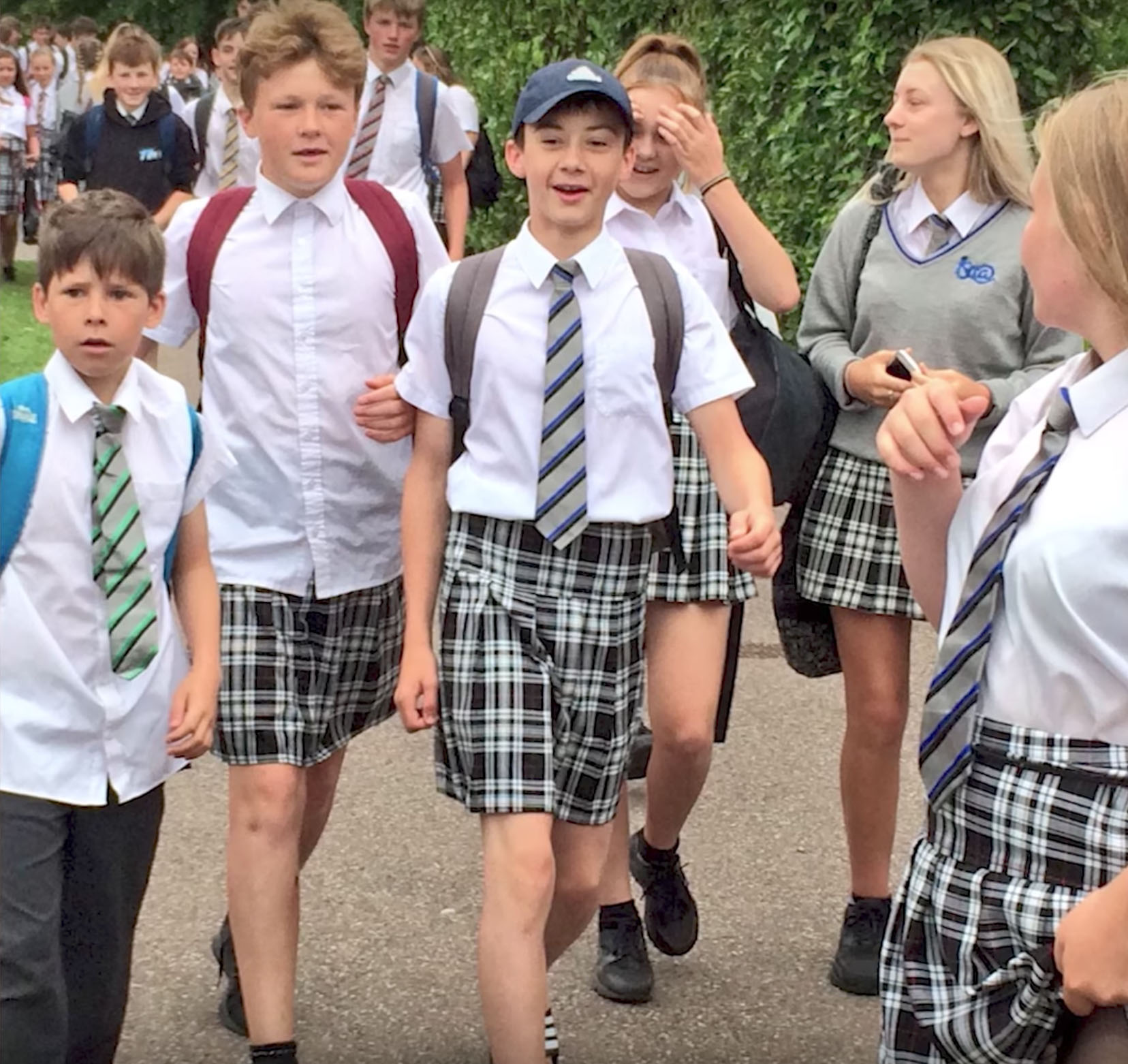 Male students at the Isca Academy in Exeter, England, wear skirts in protest of the school's shorts ban on June 22, 2017.