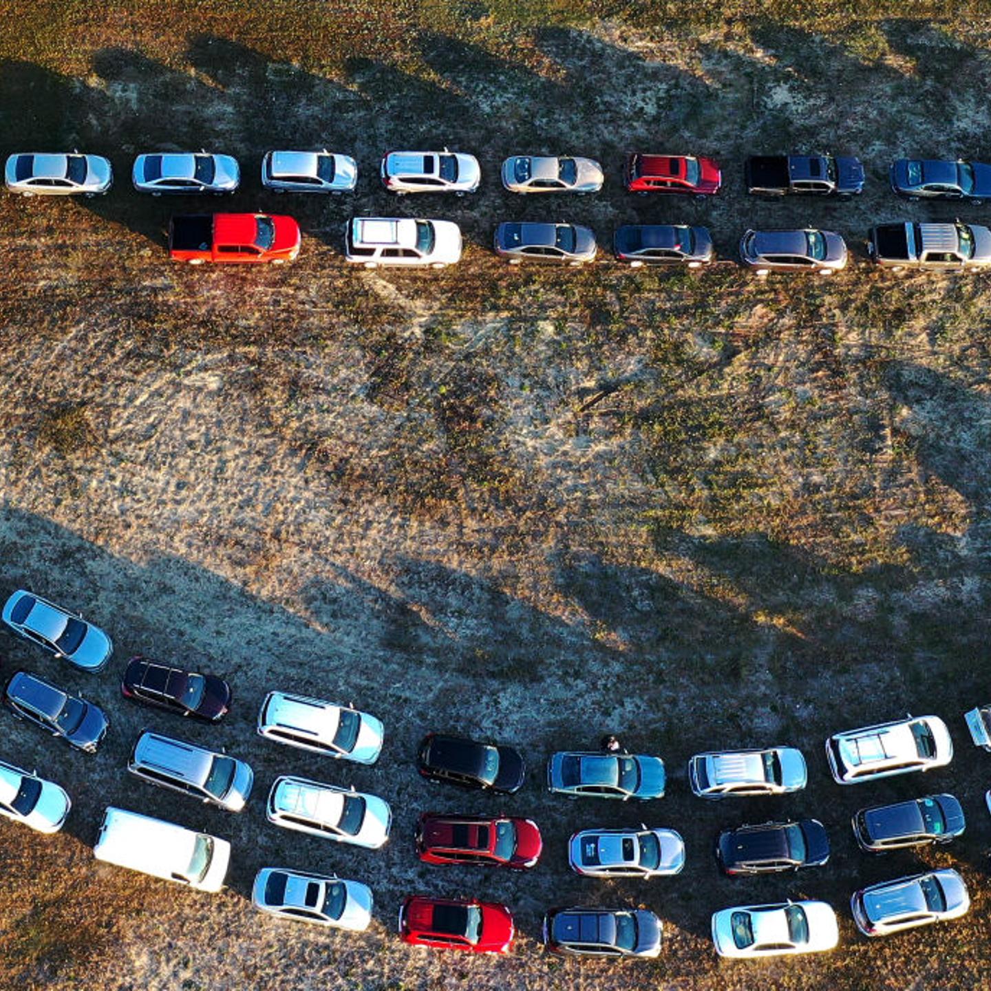 In this aerial view from a drone, people line up in their cars to receive food assistance at the Share Your Christmas food distribution event sponsored by the Second Harvest Food Bank of Central Florida, Faith Neighborhood Center and WESH 2 at Hope Inter