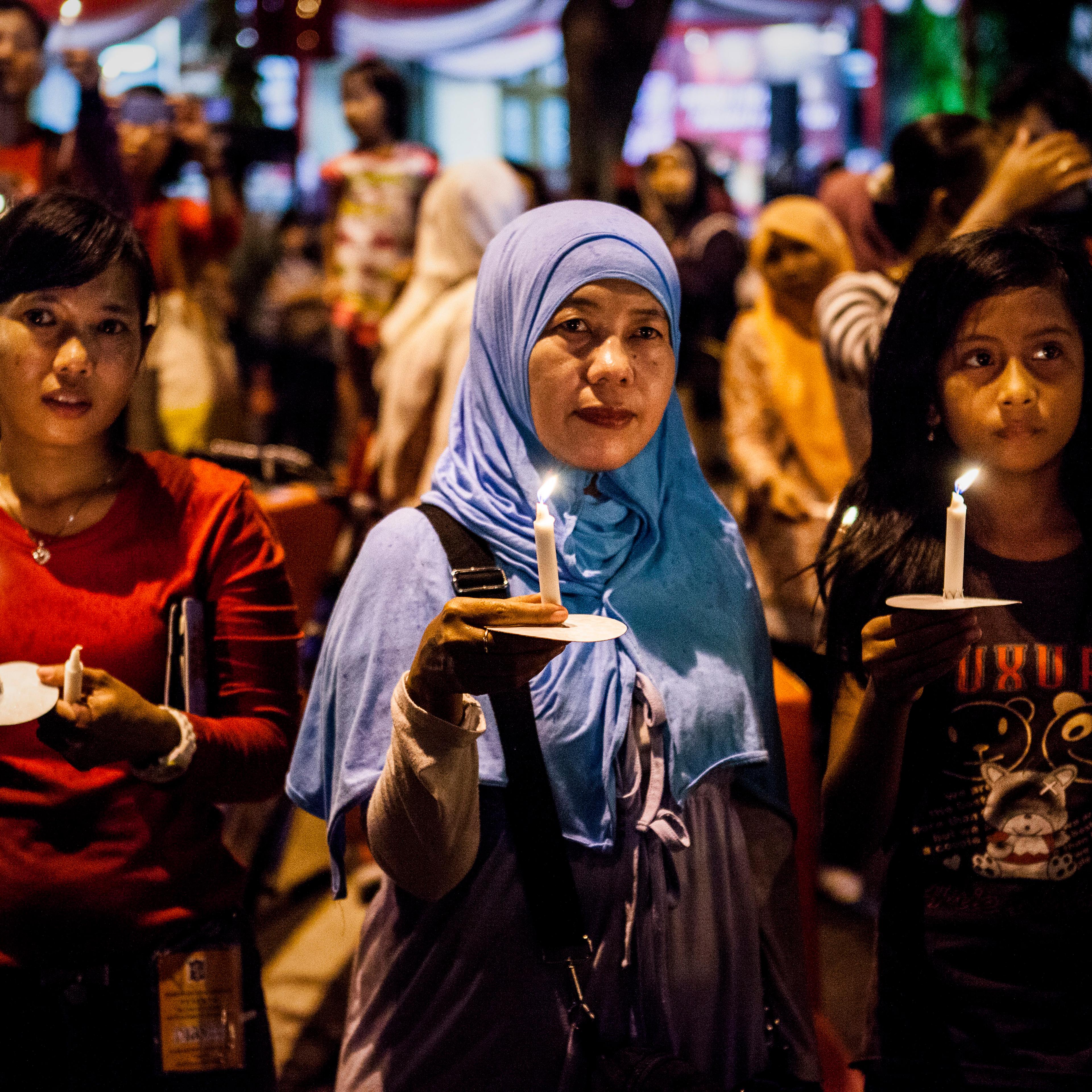 Residents pray for victims of AirAsia Flight QZ 8501 crash on Dec. 31, 2014, in Surabaya, Indonesia