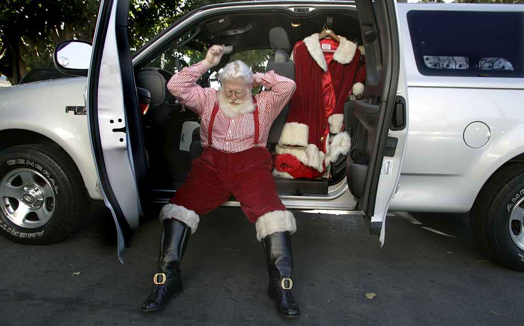 Timothy Connaghan takes off his heavy coat and combs his white hair on Dec. 21, 2004.