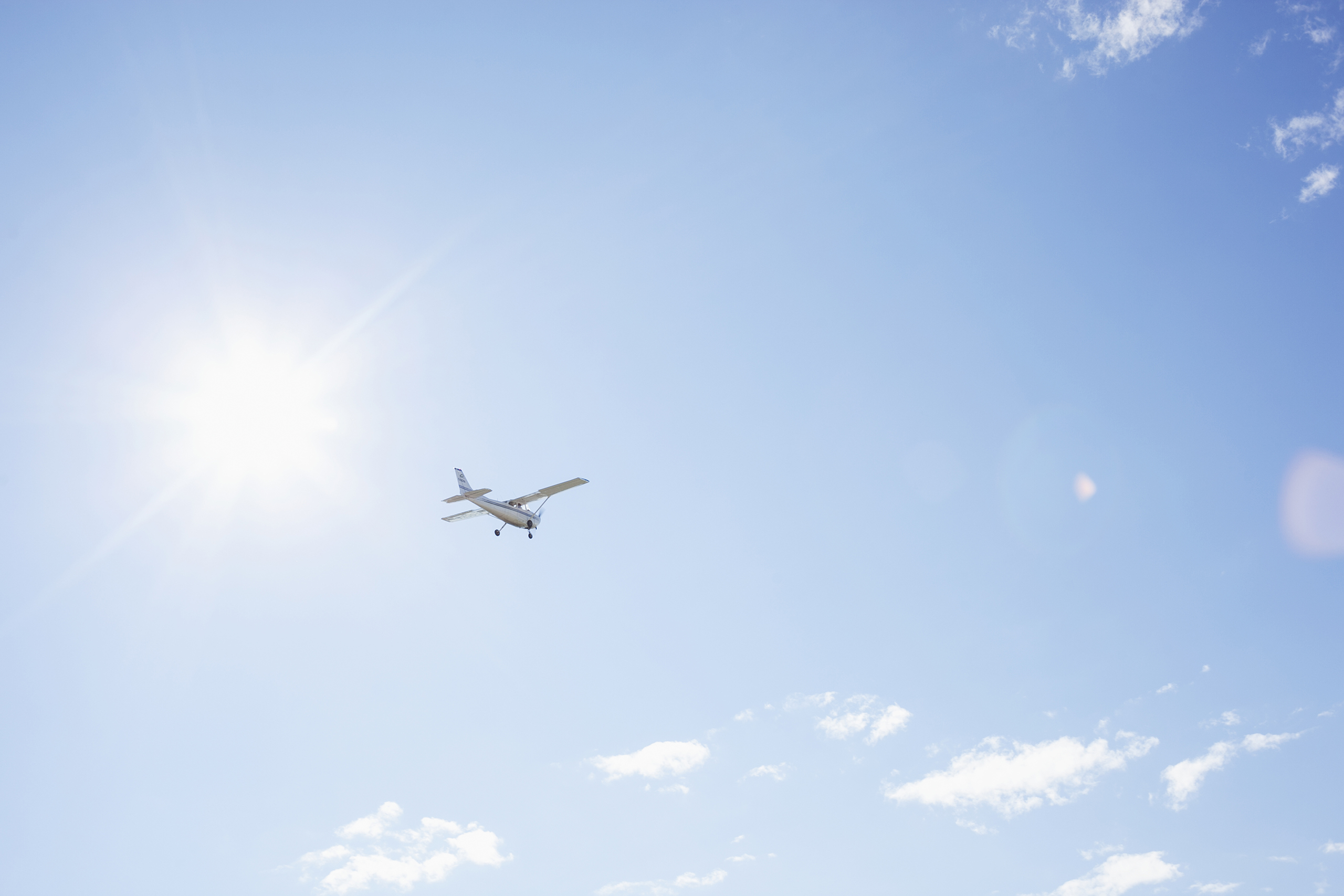 Airplane flying against a blue sky