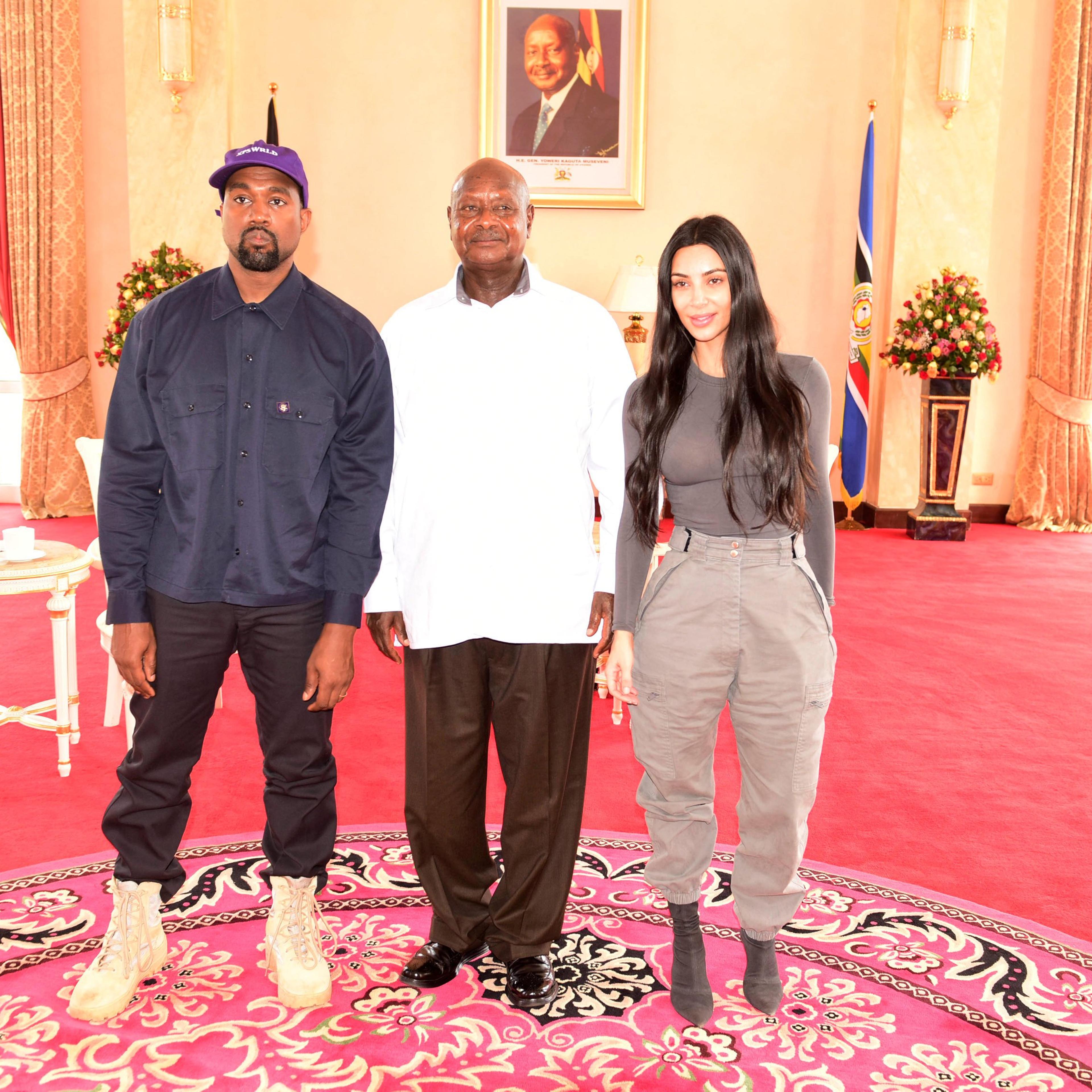 Rapper Kanye West and Kim Kardashian pose for a photograph with Uganda's President Yoweri Museveni when they paid a courtesy call at State House, Entebbe