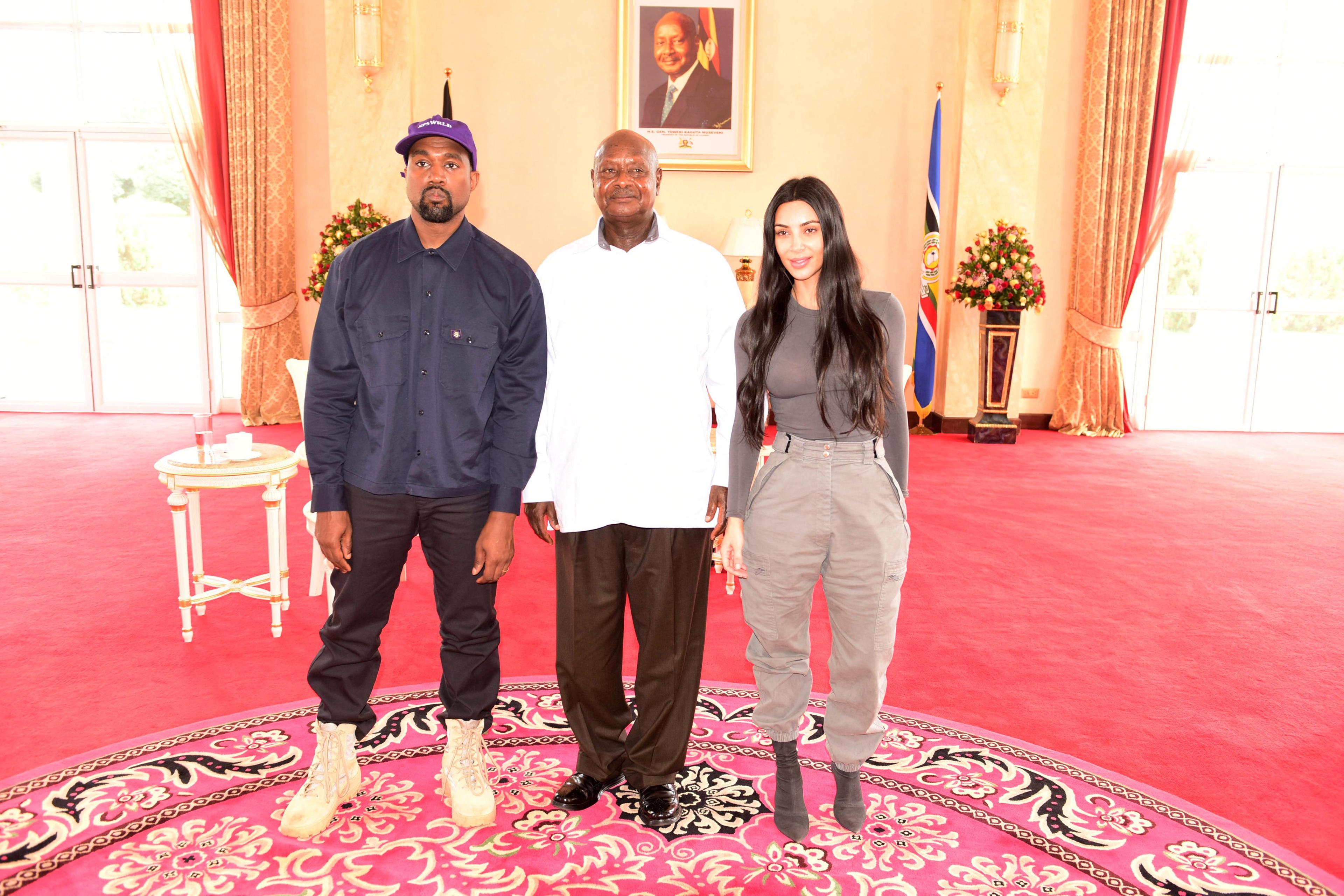 Rapper Kanye West and Kim Kardashian pose for a photograph with Uganda's President Yoweri Museveni when they paid a courtesy call at State House, Entebbe