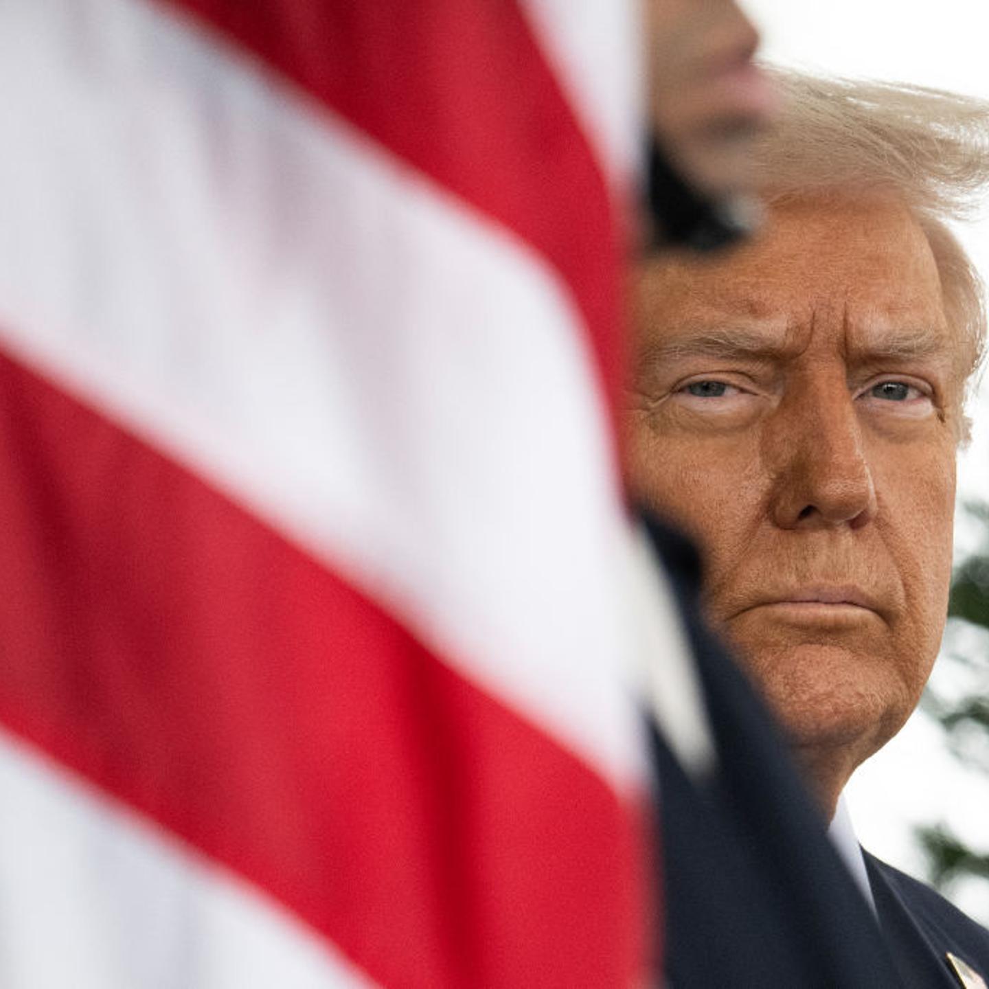 U.S. President Donald Trump waits outside of the West Wing of the White House on Feb. 11, 2025.