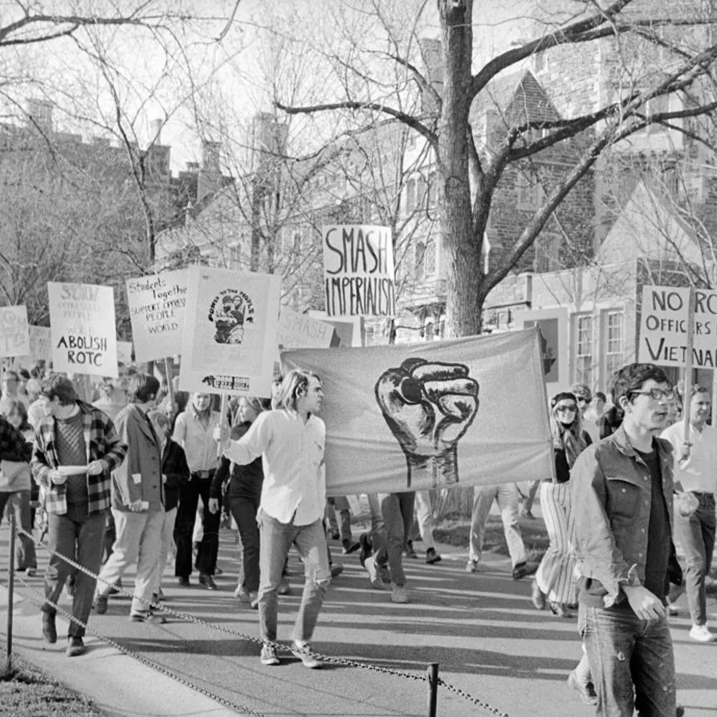 In this black and white photo taken on campus, students at Princeton University march with signs to protest war and the R.O.T.C. on April 25, 1969.
