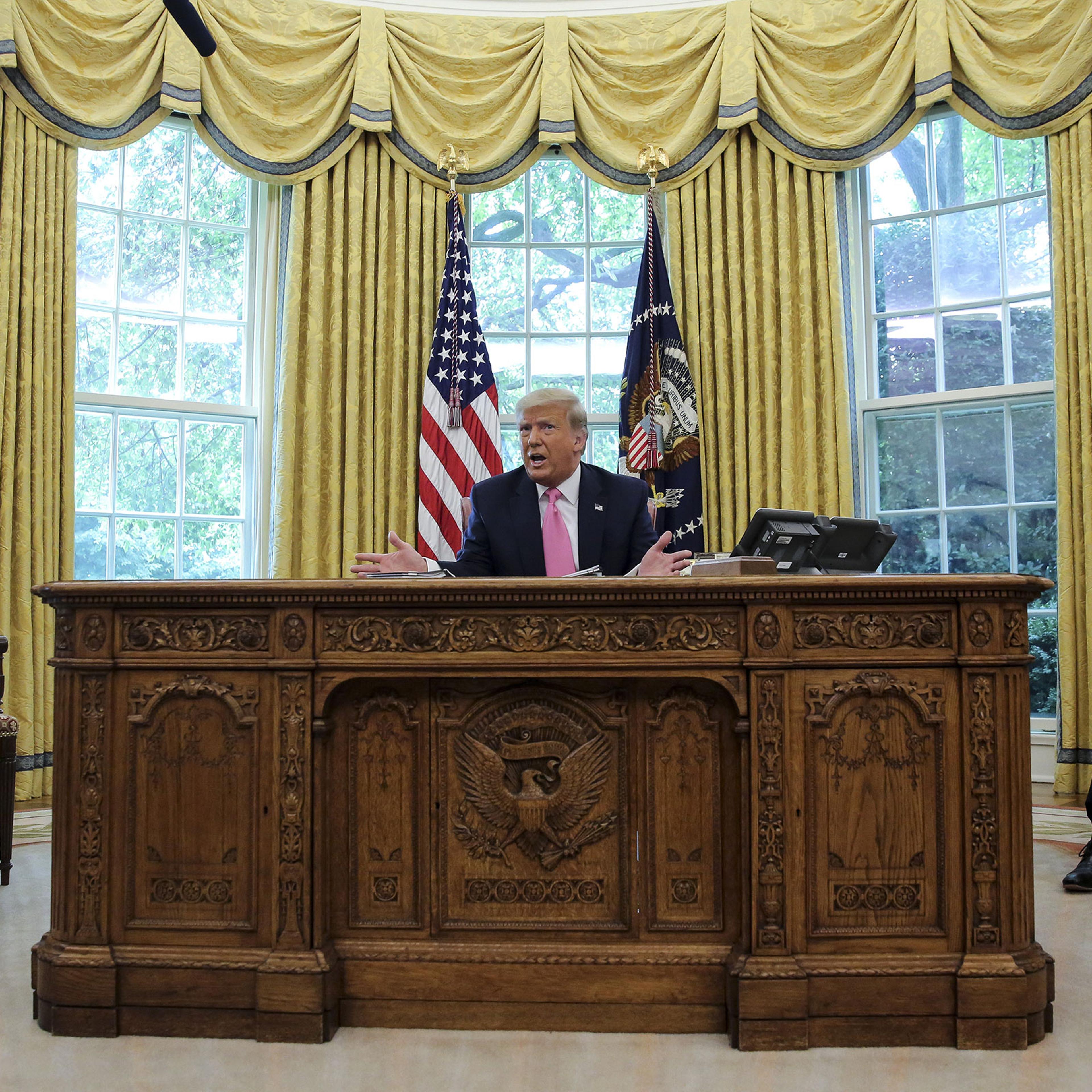 President Donald Trump speaks as Senate Majority Leader Mitch McConnell Vice President Mike Pence listen during a meeting in the Oval Office of the White House on July 20, 2020.