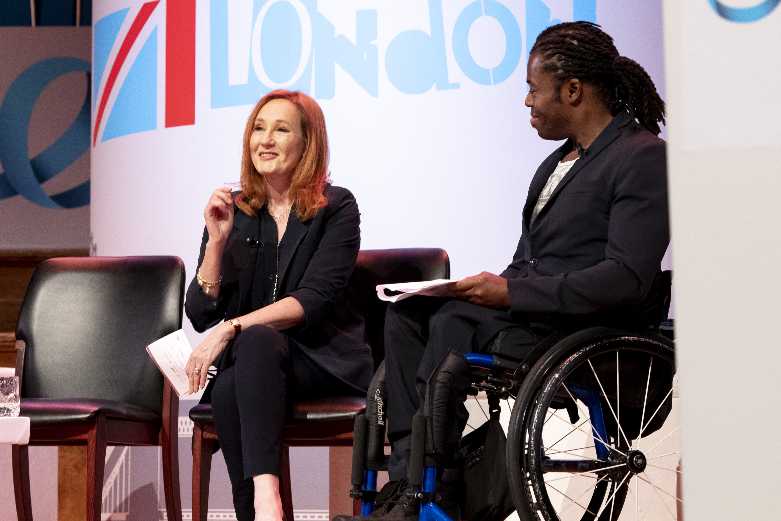 The author J.K. Rowling alongside U.K. paralympian Ade Adepitan at the One Young World global forum in London on Oct. 24