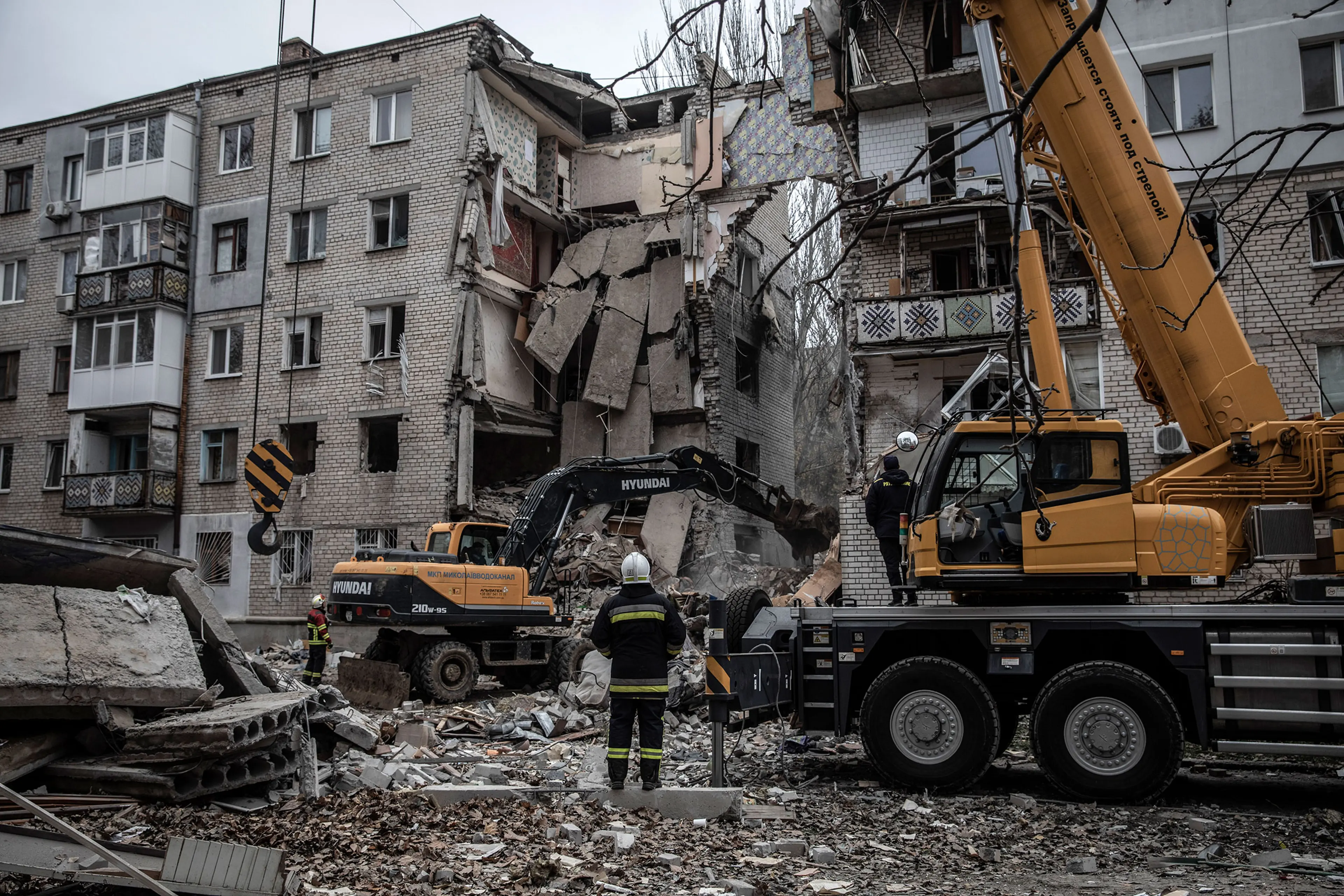 Rescue workers at a damaged apartment block in Mykolaiv on Nov. 11, 2022.