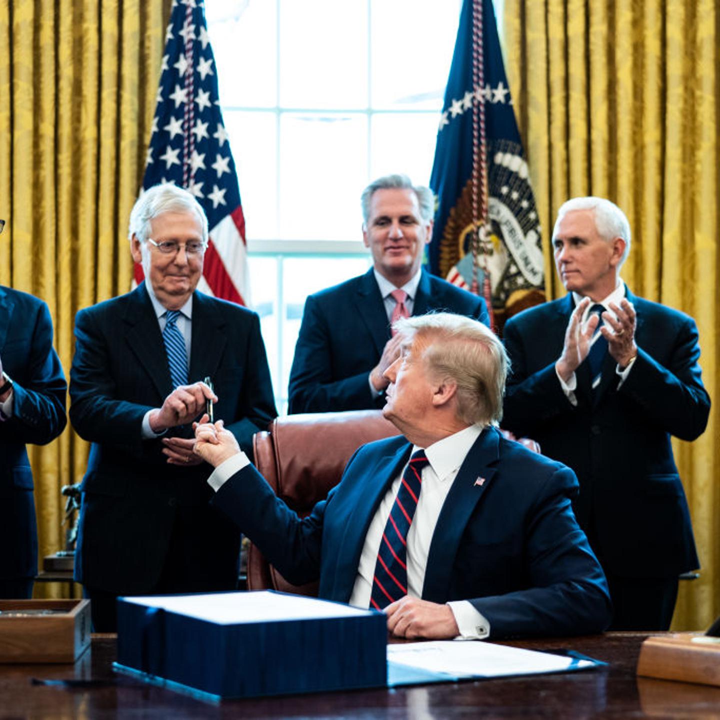 President Trump Signs Coronavirus Stimulus Bill In The Oval Office
