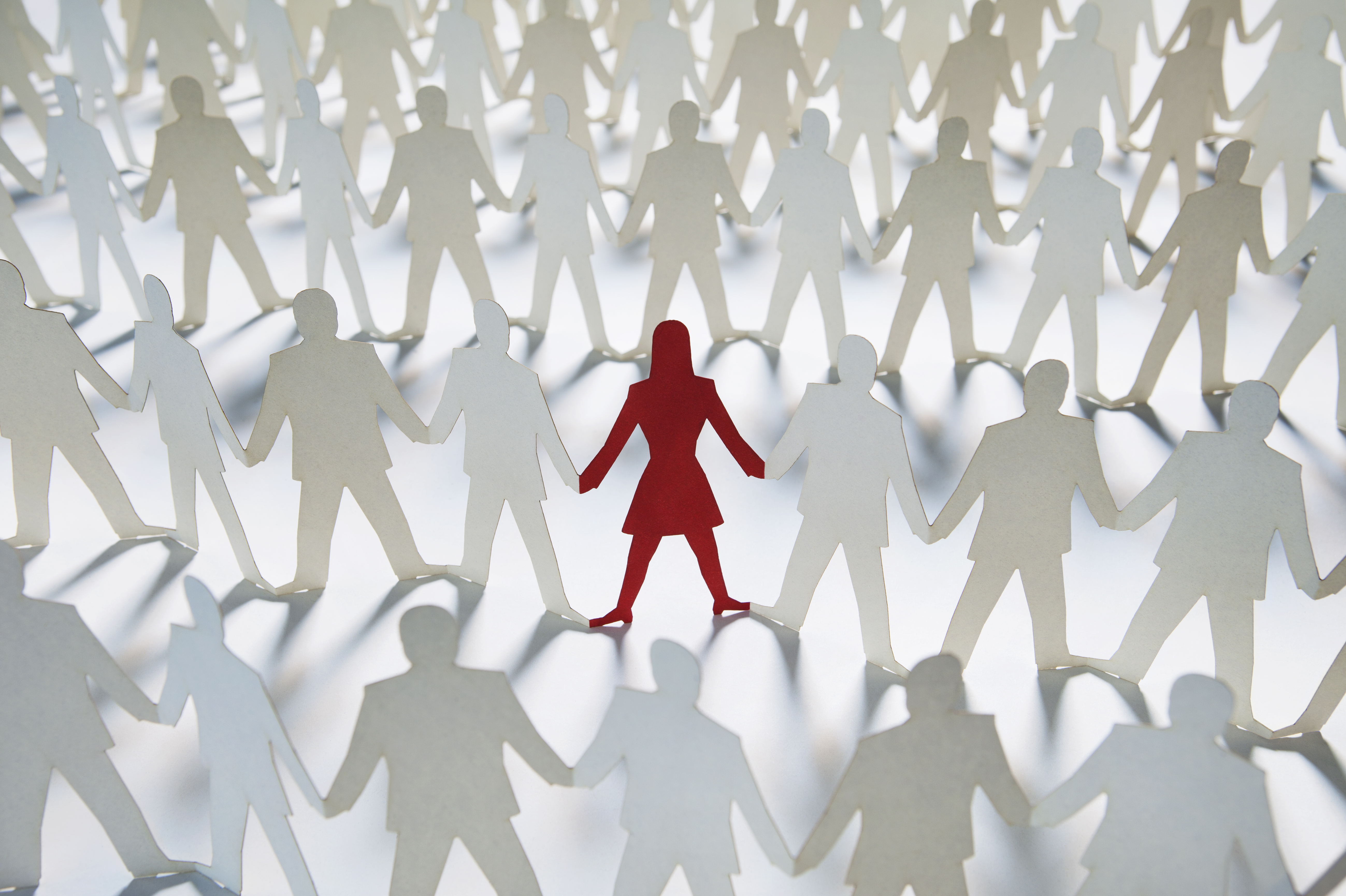 White cut-out men with red woman in the center