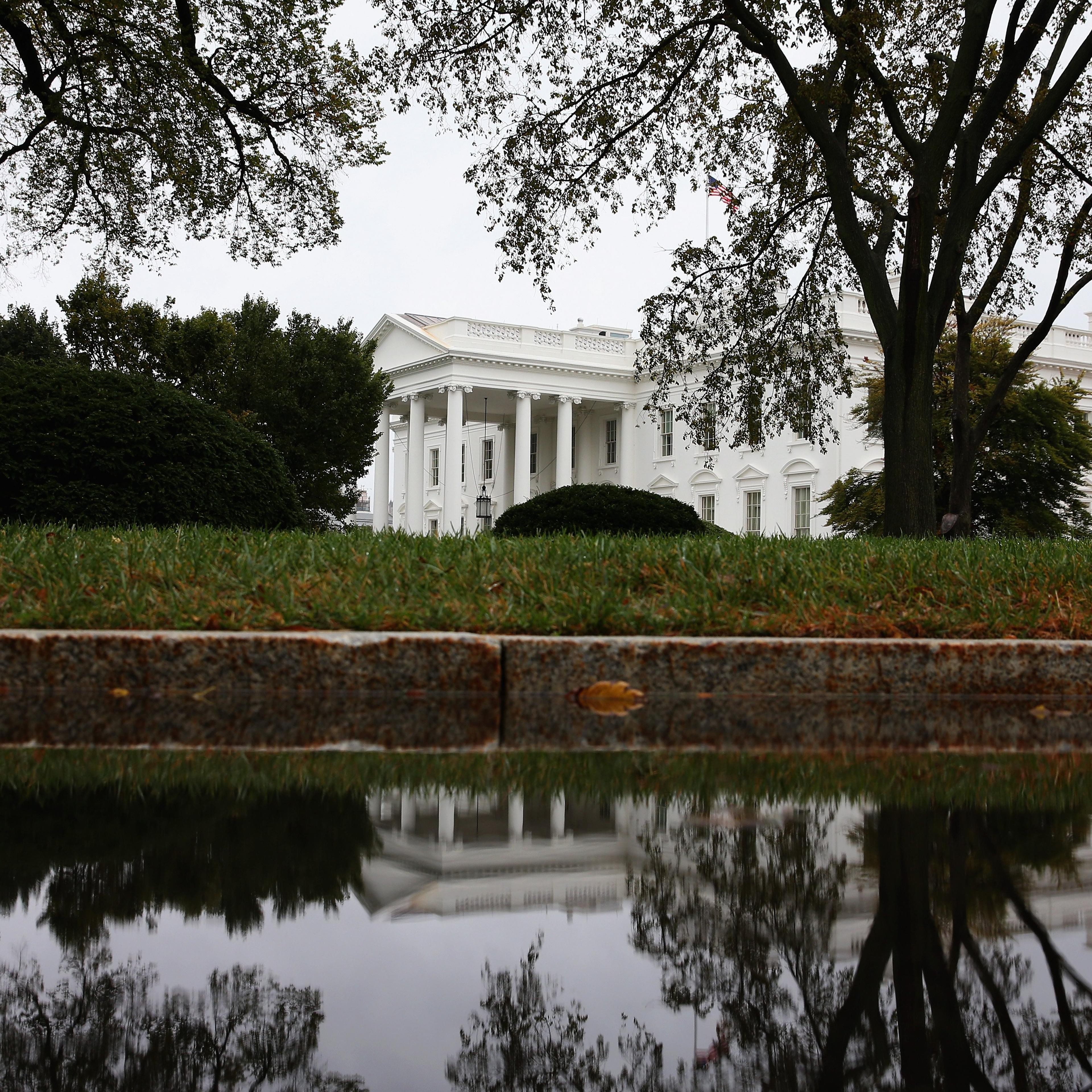 The White House Is Reflected On Driveway Puddle