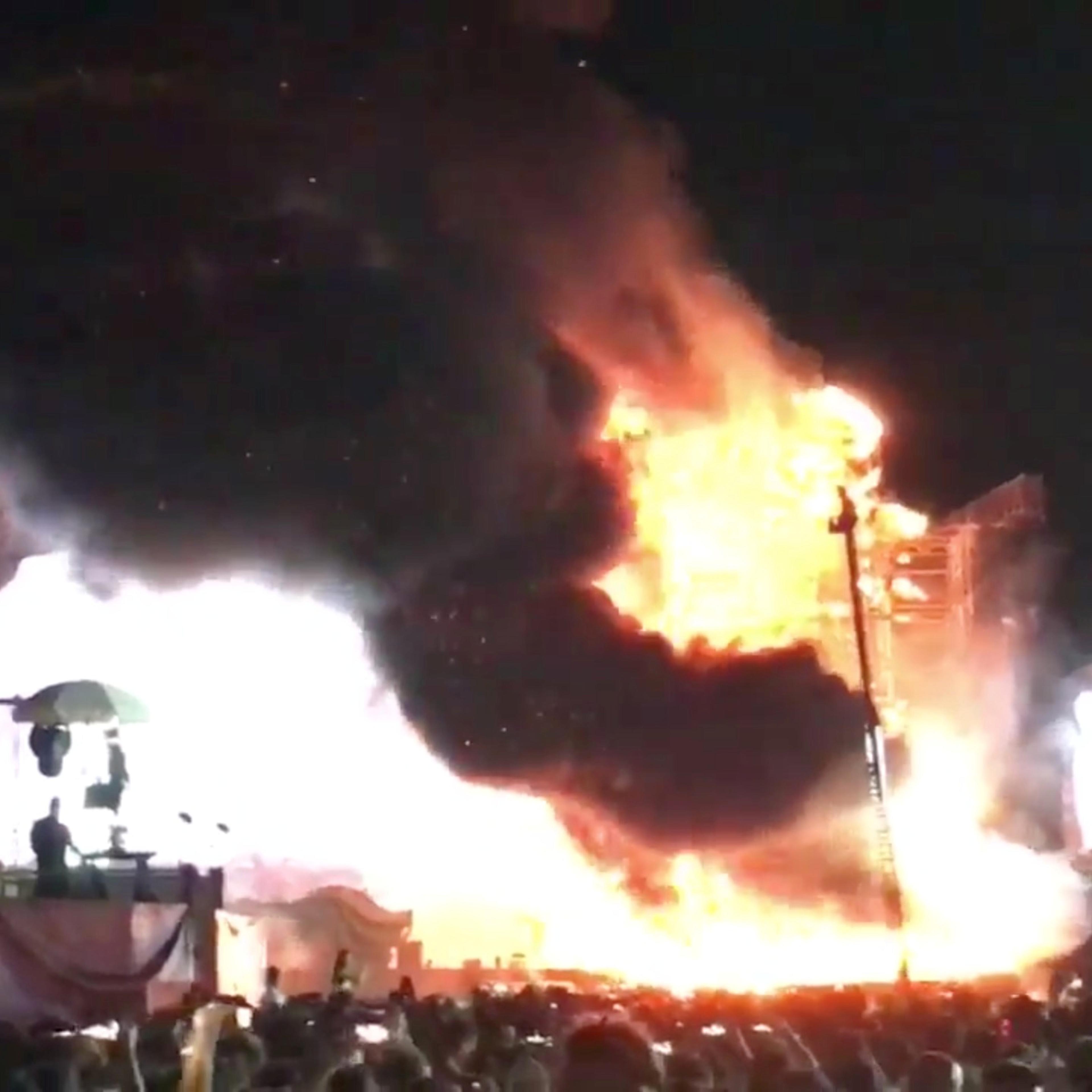 Smoke is seen rising from flames engulfing the stage after a fire broke out at Tomorrowland Unite Spain festival in Barcelona