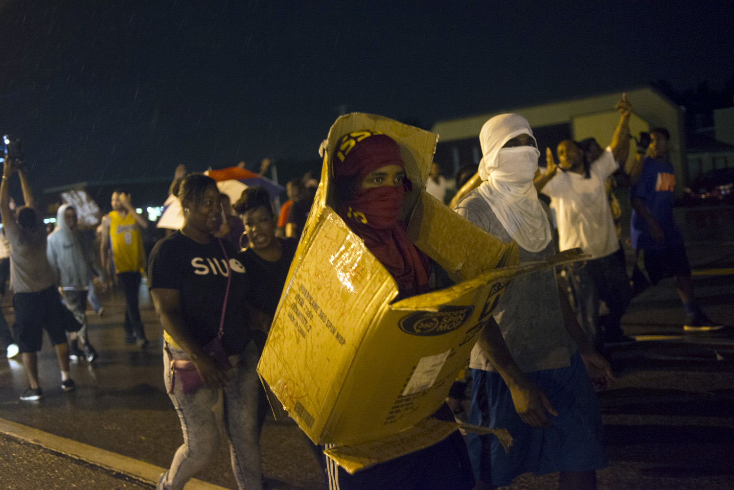 Protestors march on Florissant Ave. in Ferguson, Mo.