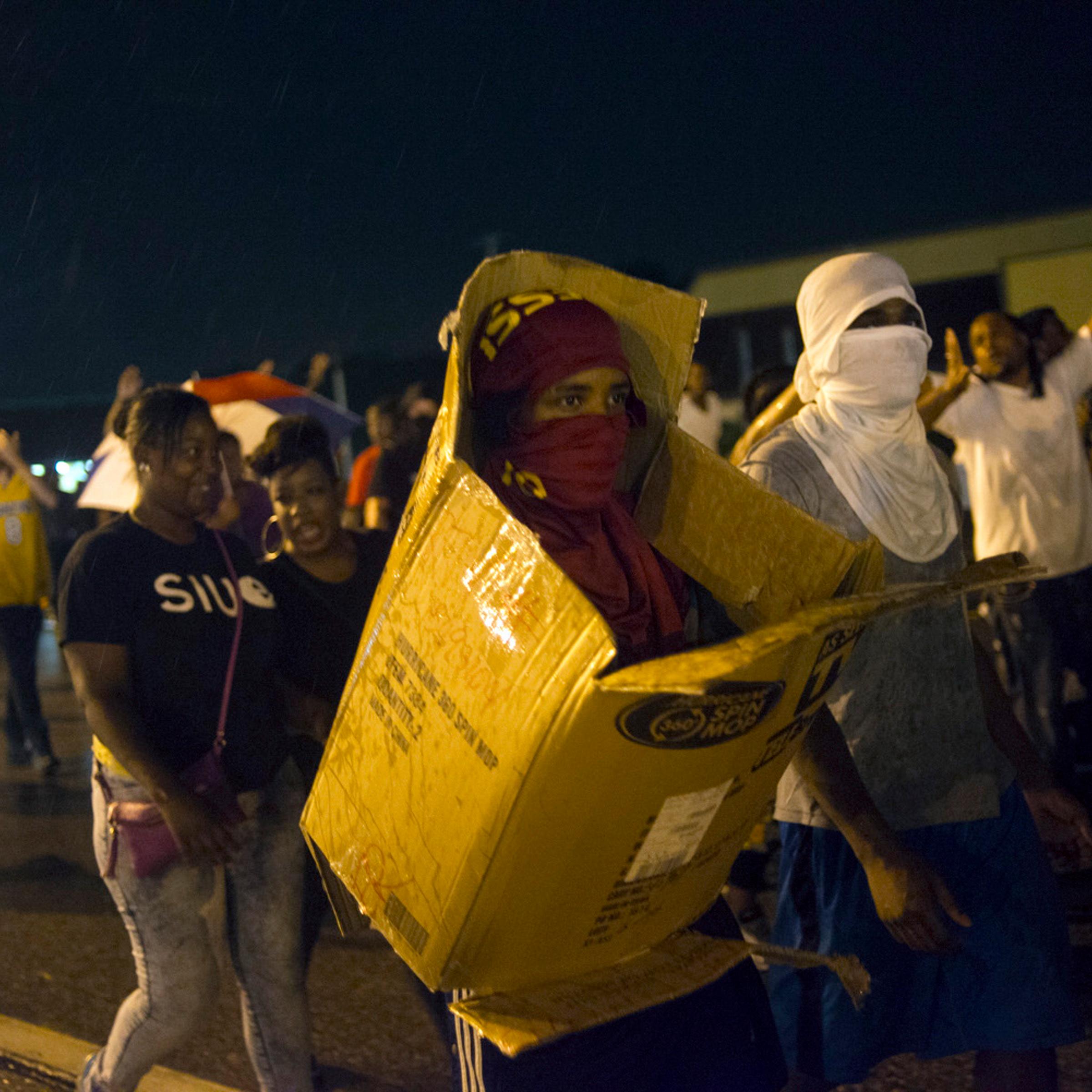 Protestors march on Florissant Ave. in Ferguson, Mo.