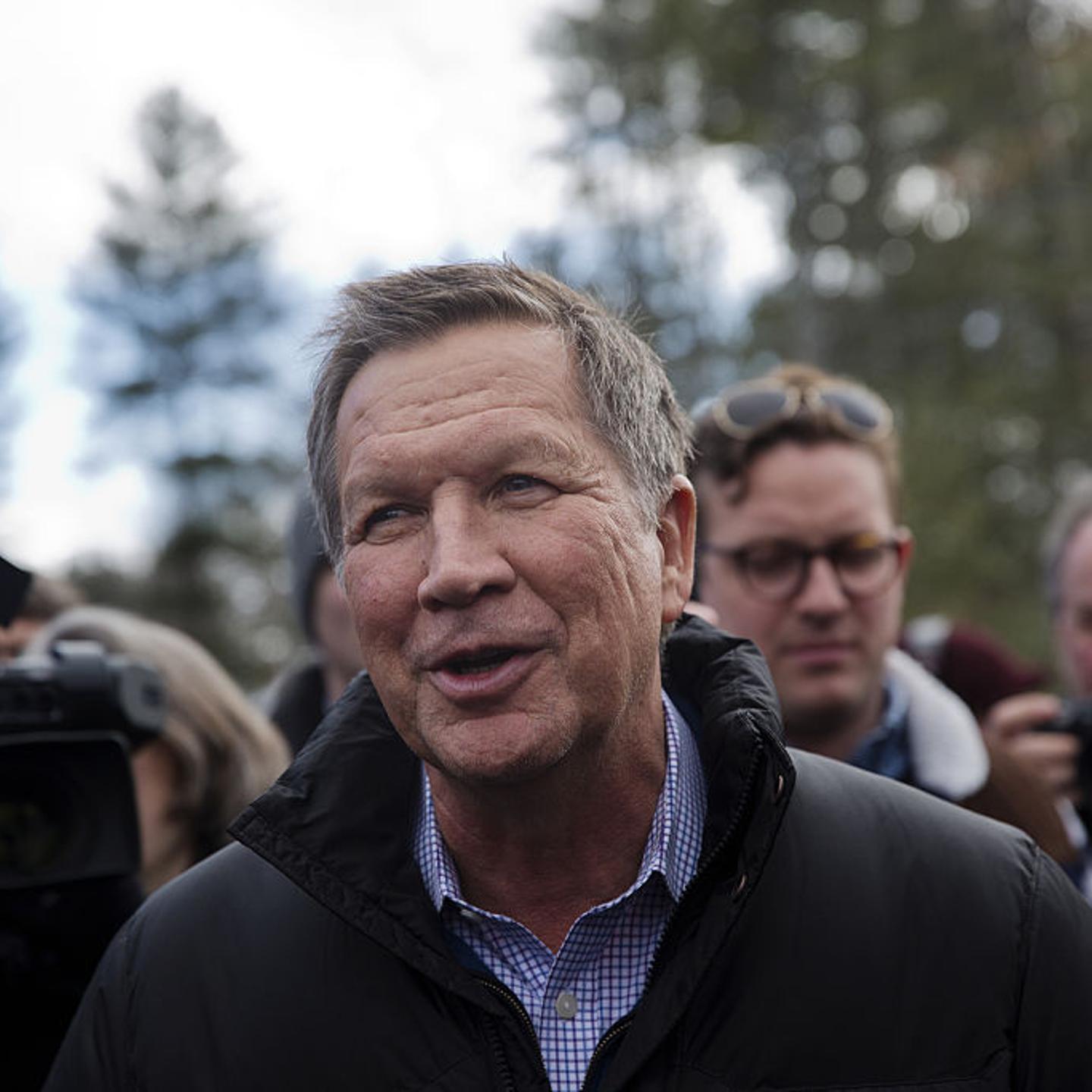 John Kasich, governor of Ohio and 2016 Republican presidential candidate, greets voters while arriving at a polling station at Broken Gound Elementary School in Concord, New Hampshire.