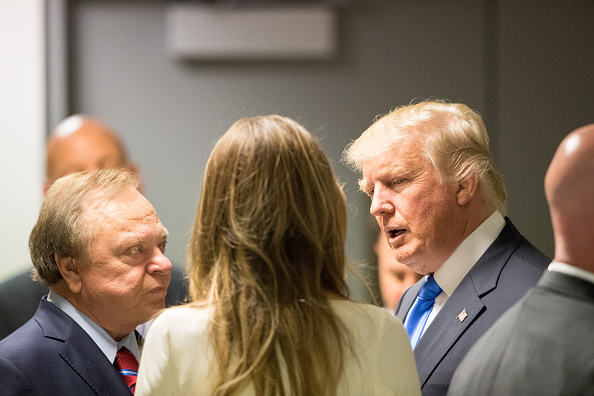 Donald Trump speaks to colleagues outside an elevator bank on July 18, 2016 at Quicken Loans Arena in Cleveland, Ohio.