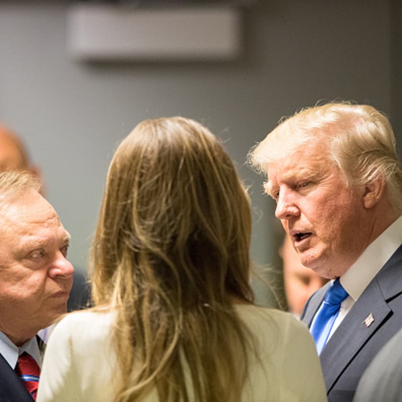 Donald Trump speaks to colleagues outside an elevator bank on July 18, 2016 at Quicken Loans Arena in Cleveland, Ohio.