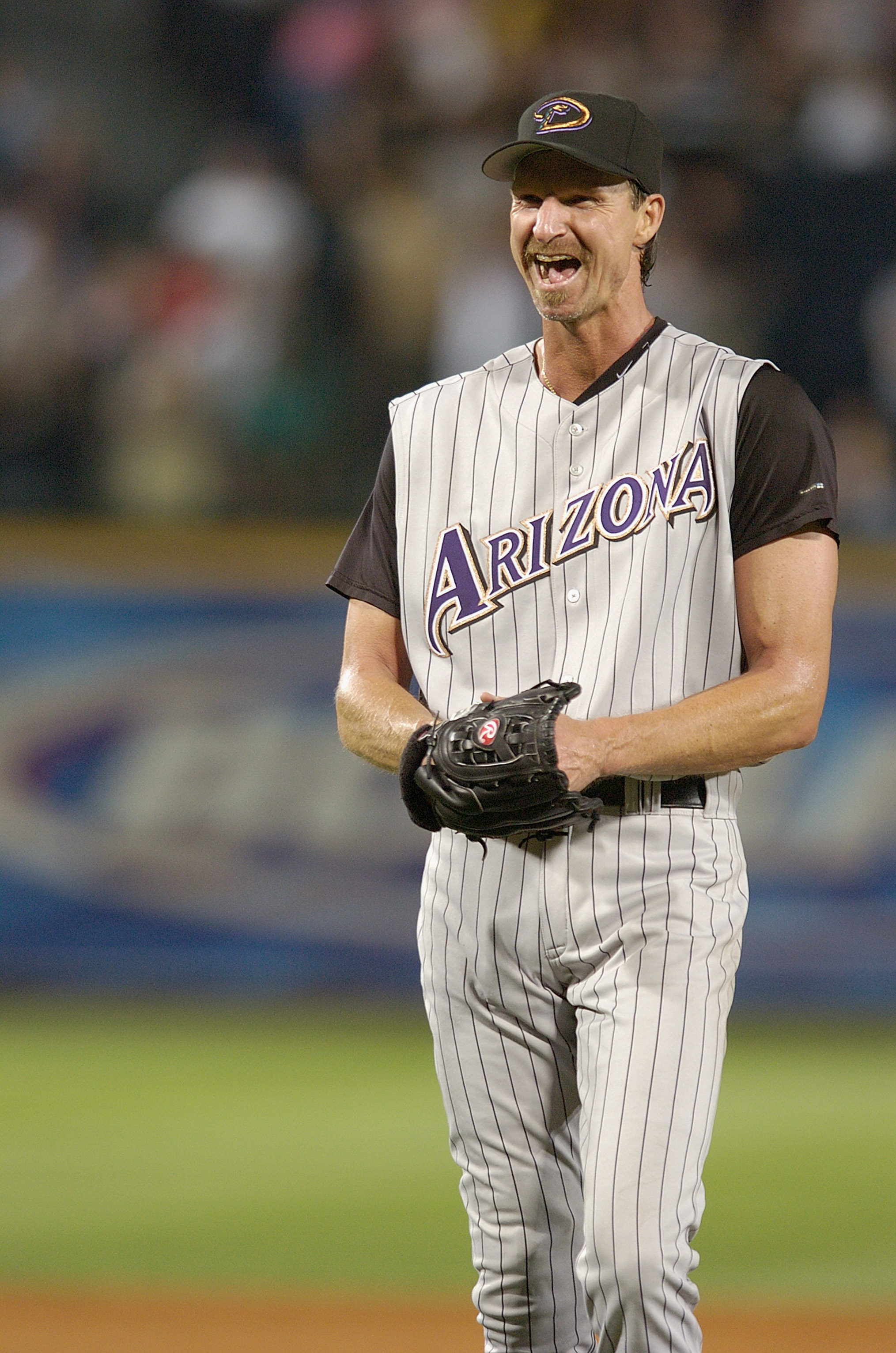 Randy Johnson smiles after pitching a perfect game between the Arizona Diamondbacks and the Atlanta Braves at Turner Field in Atlanta on May 18, 2004.