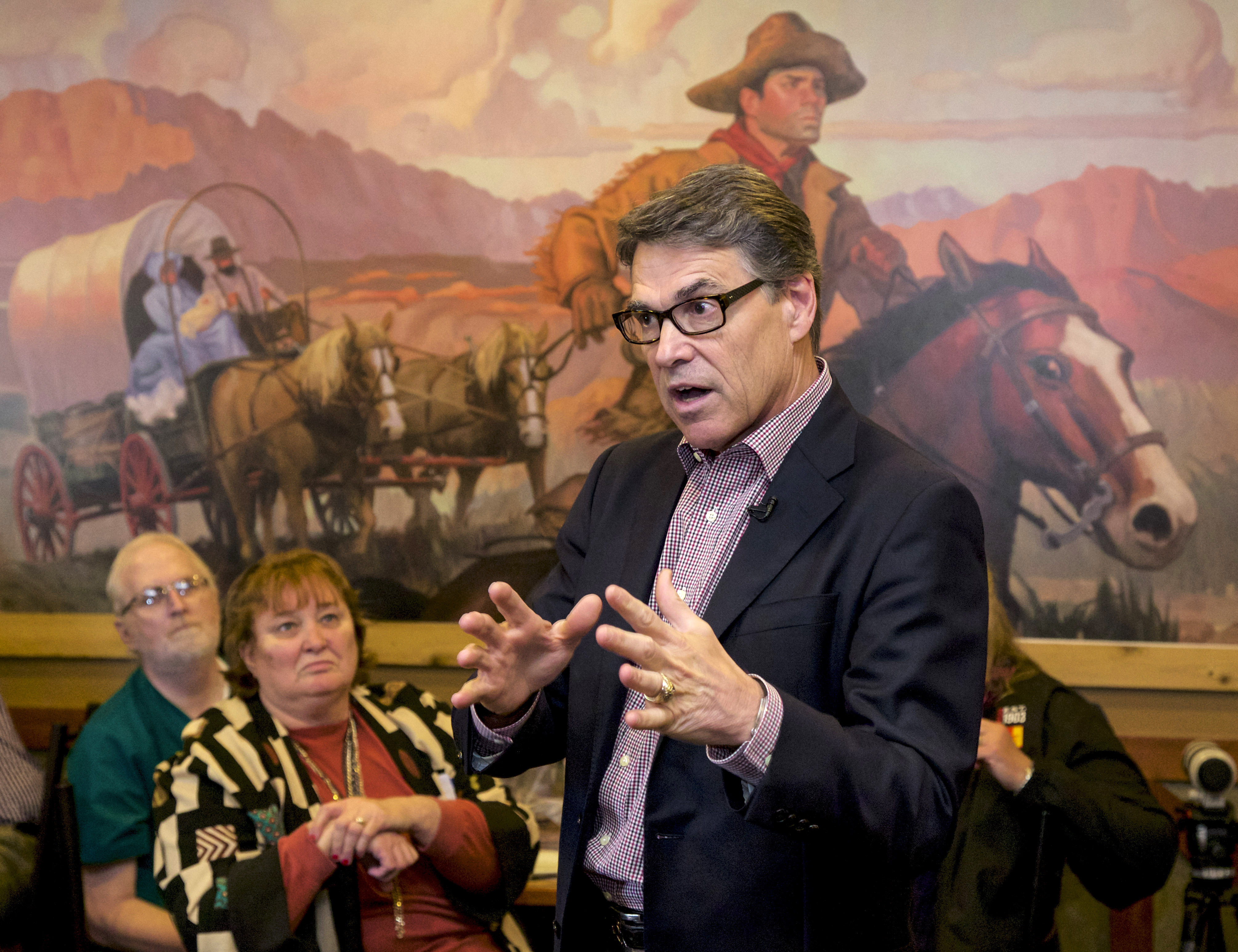 Former Texas Gov. Rick Perry speaks during a meet and greet event at Pizza Ranch in Sioux Center, Iowa